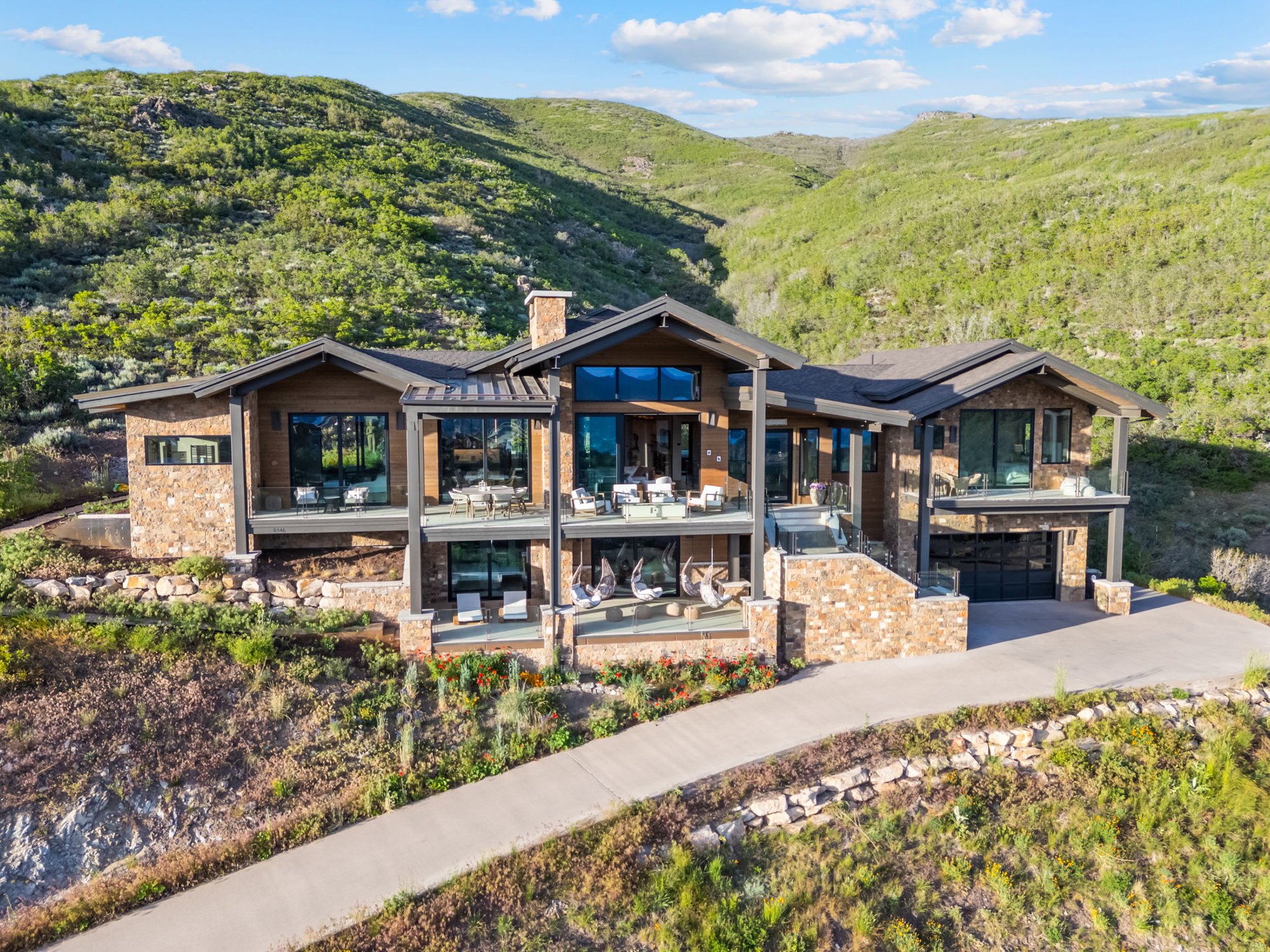 Mountain modern residence featuring extensive stone and wood siding