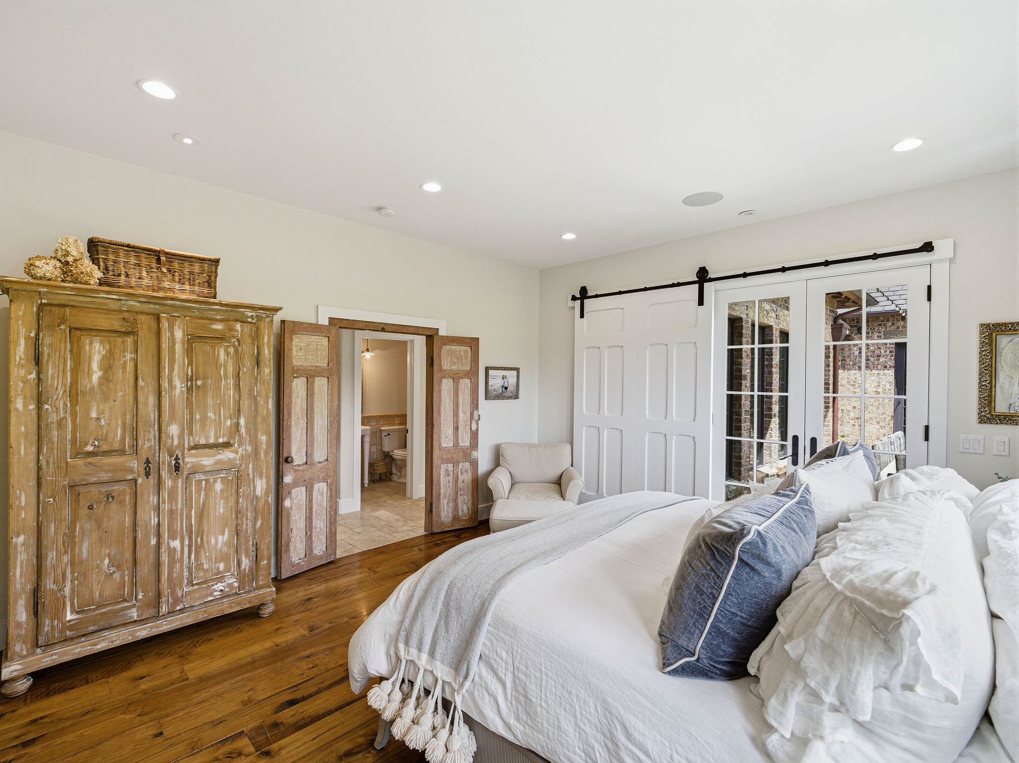 White walls with recessed lighting and built-in ceiling speakers