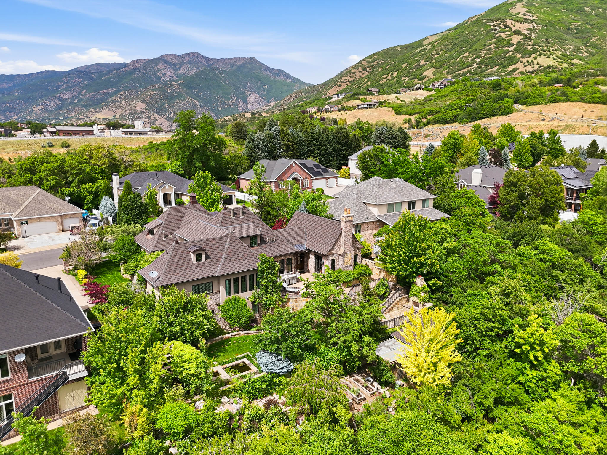 Expansive residence with a multi-gabled roofline and stone exterior accents