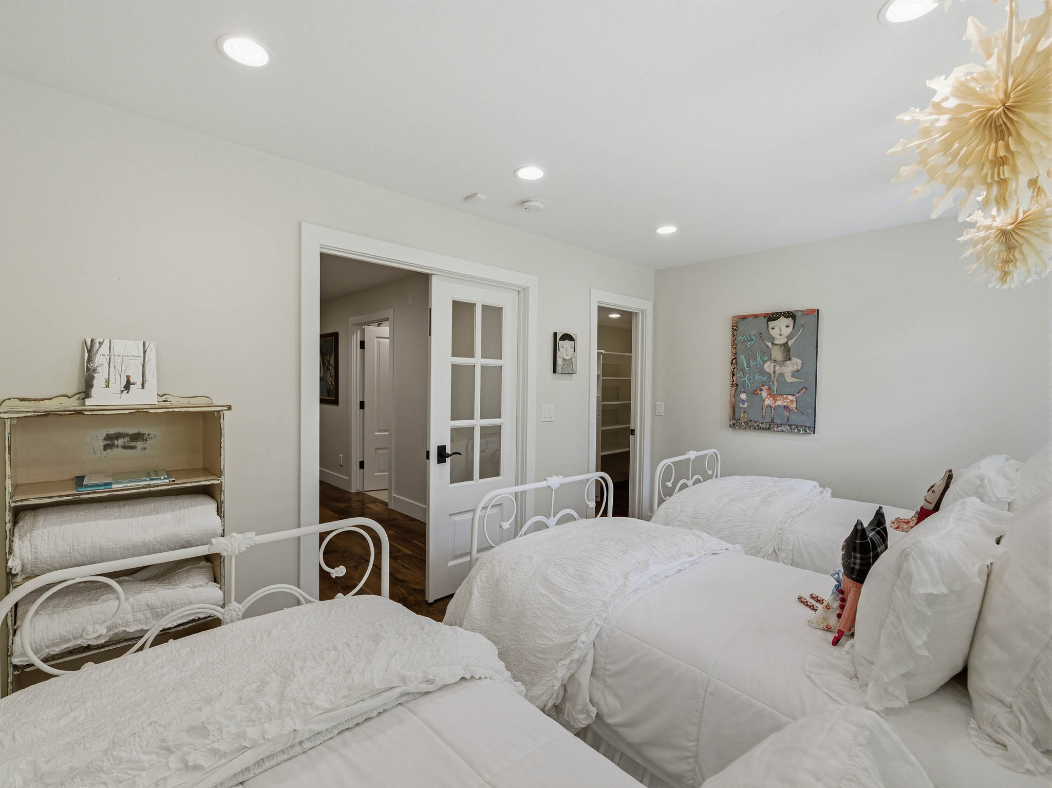 Spacious room with recessed lighting and neutral wall tones