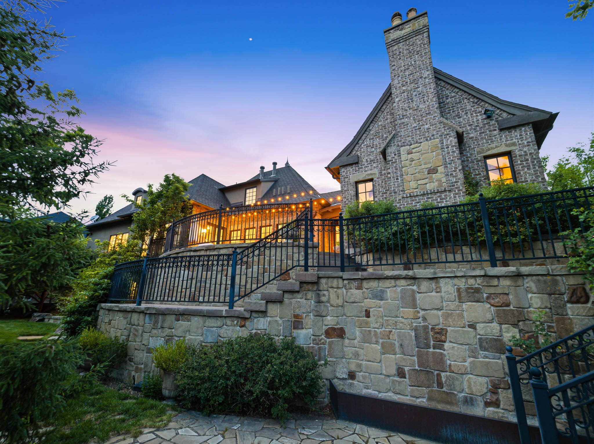 Stone and brick exterior with a prominent chimney feature