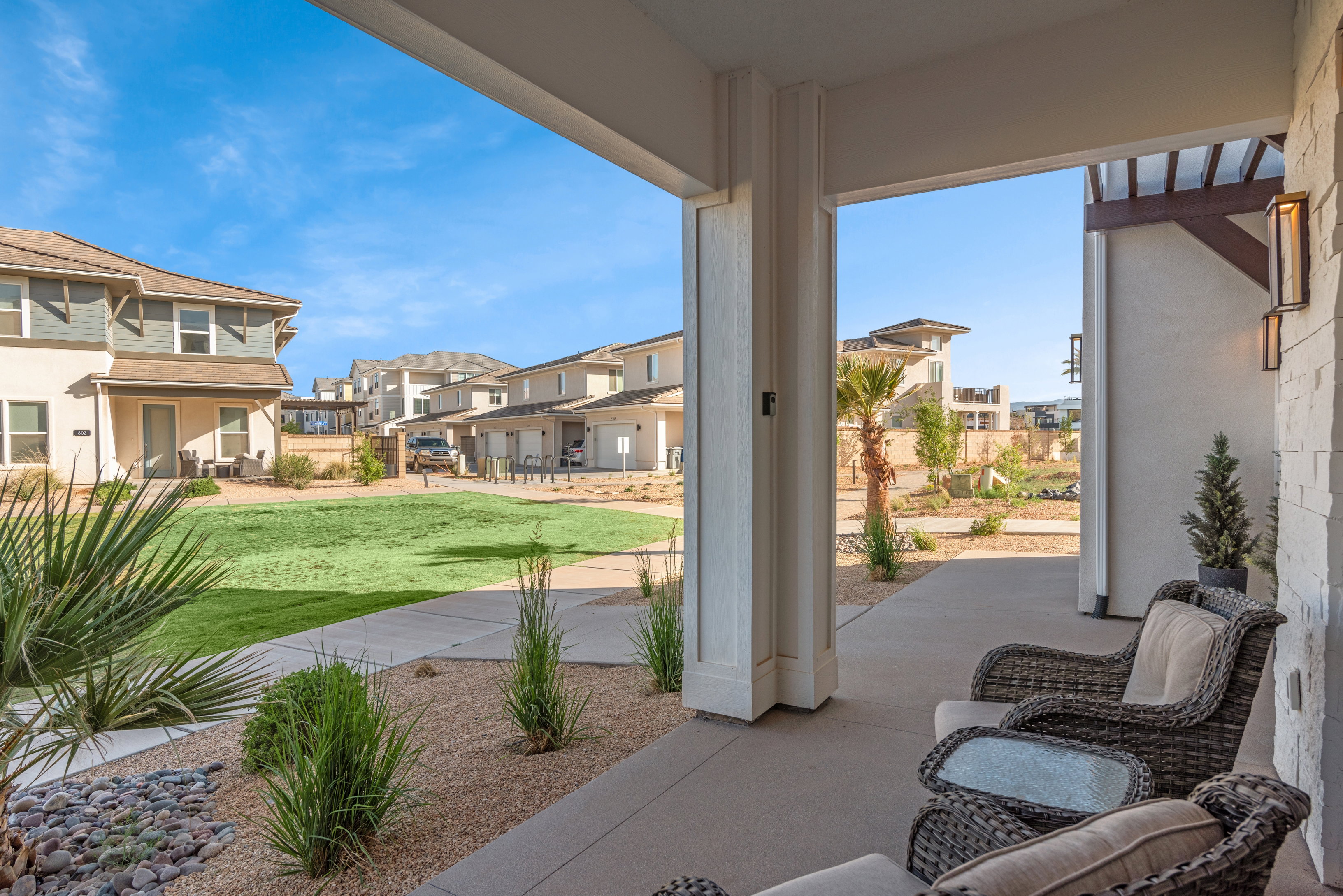 Covered patio featuring concrete flooring and stone veneer accent wall