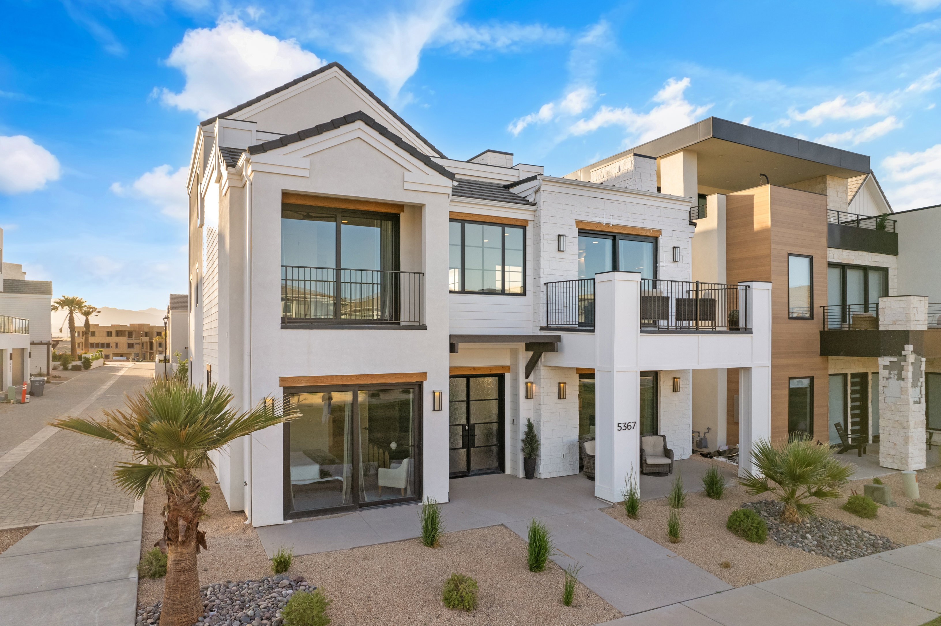 Modern exterior featuring white stucco and horizontal siding accents