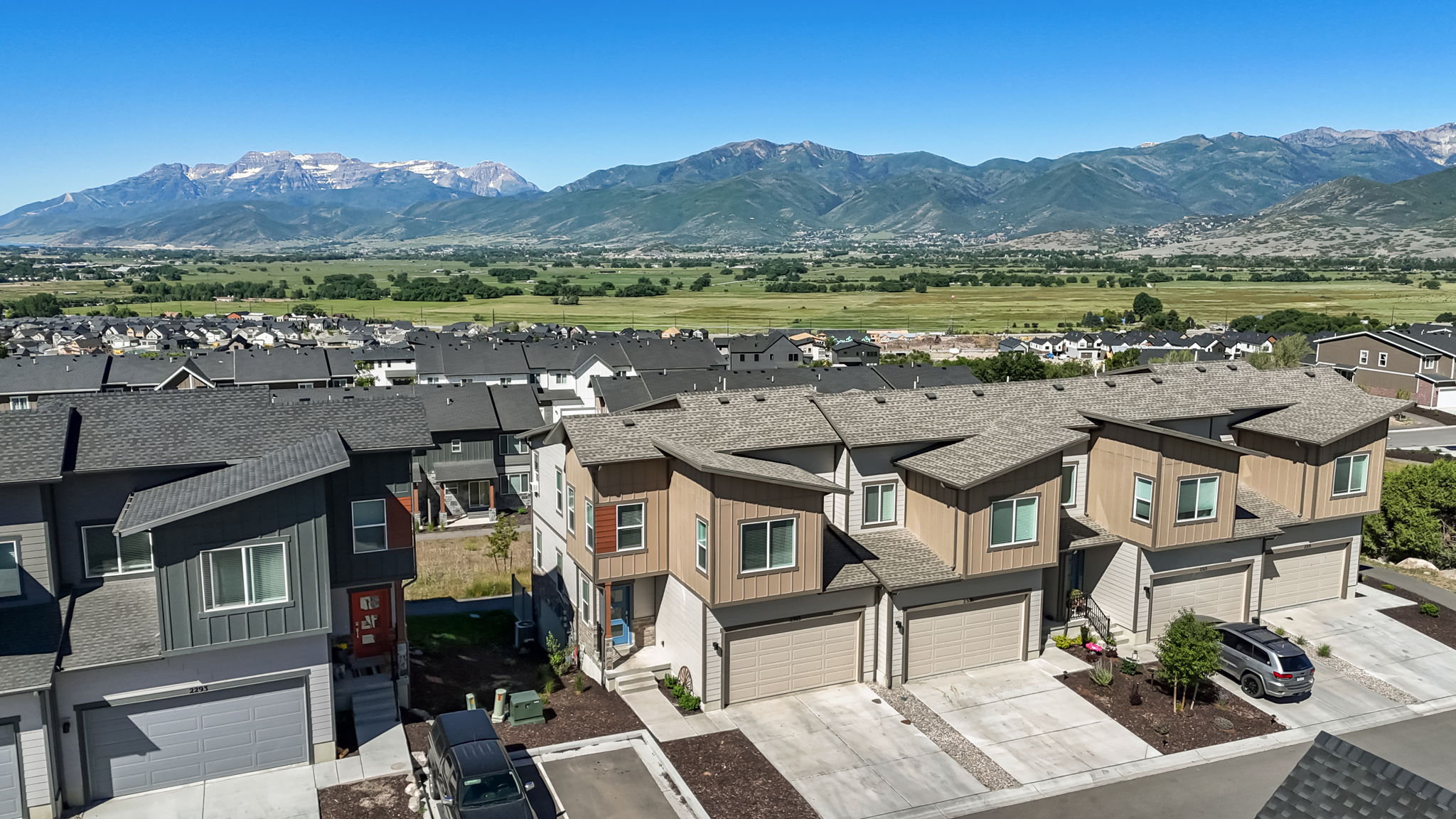 Modern townhome community featuring contemporary architectural design and mountain scenery