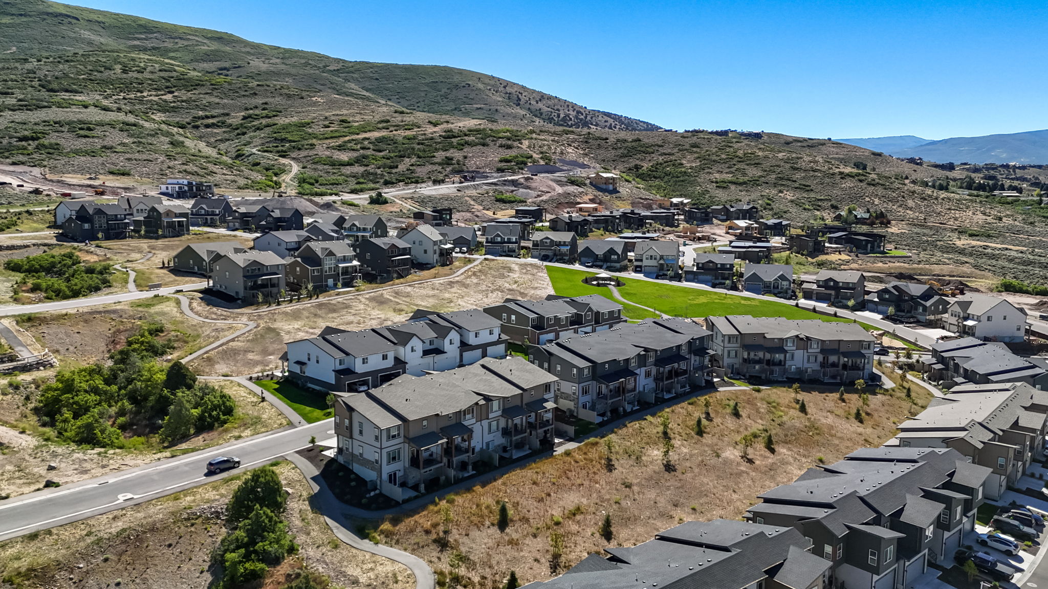 Residential development showcasing multiple multi-story structures with dark-toned roofs