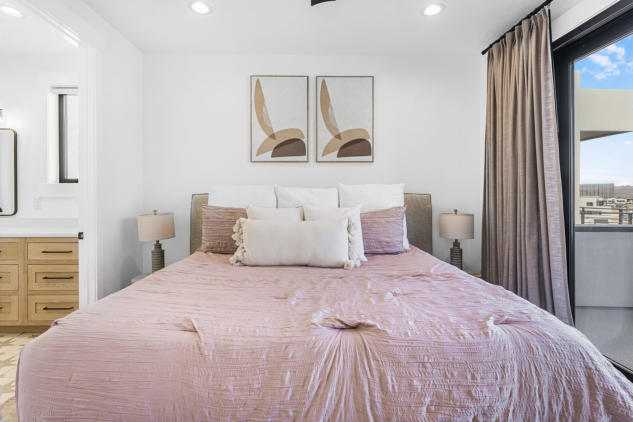 Bright bedroom featuring recessed lighting, a built-in ceiling fan, and a floor-to-ceiling glass door providing outdoor access