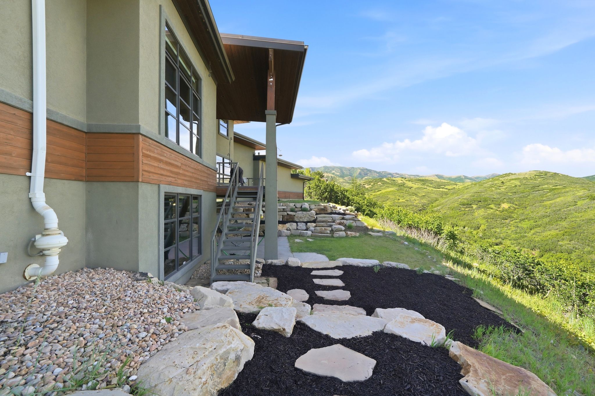 Contemporary exterior with stucco and wood-panel accents