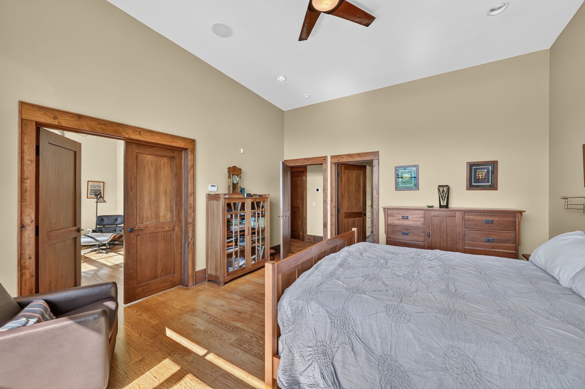 Hardwood flooring throughout, featuring natural wood doors and trim
