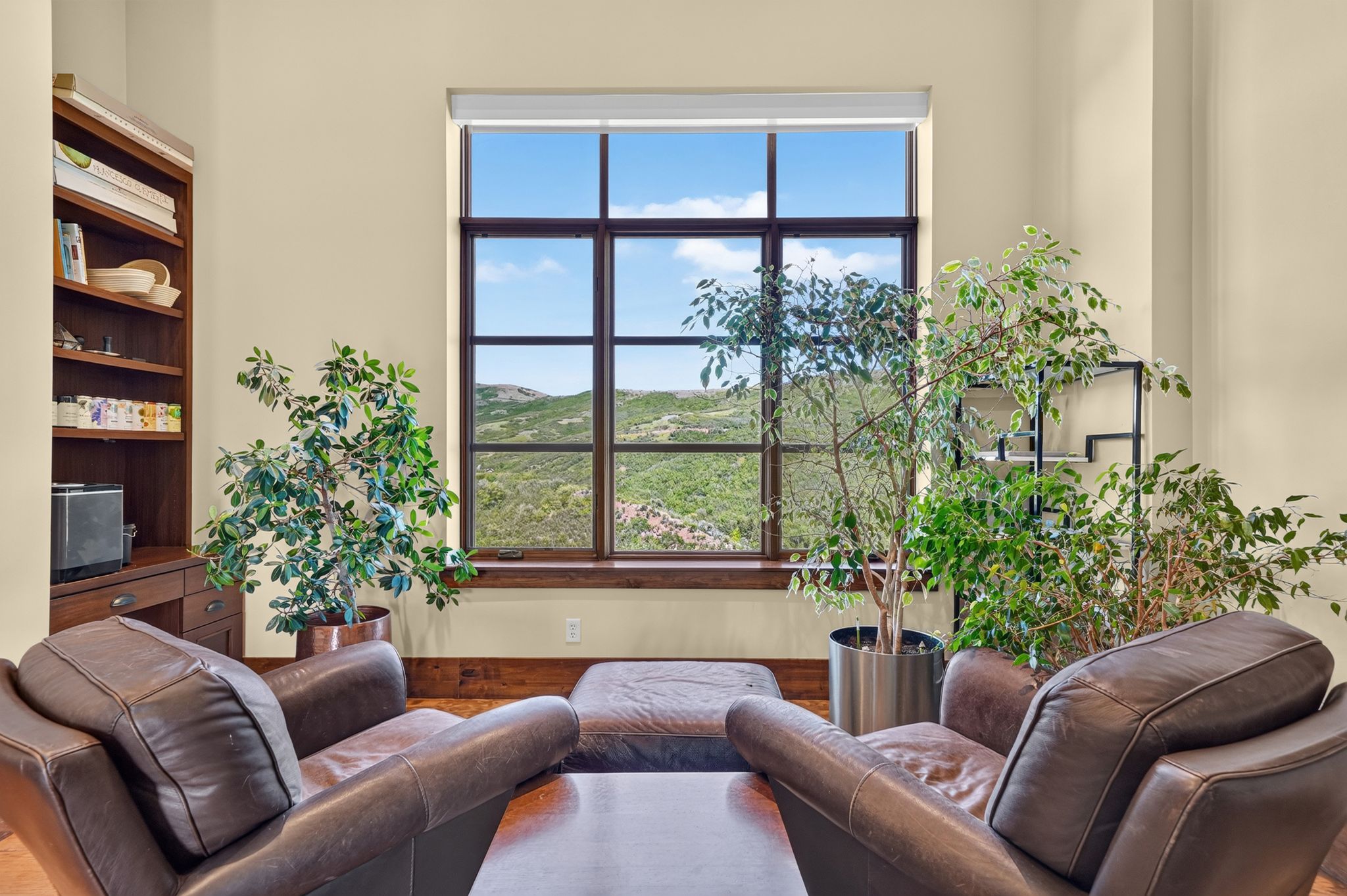 Expansive picture window framing distant hills