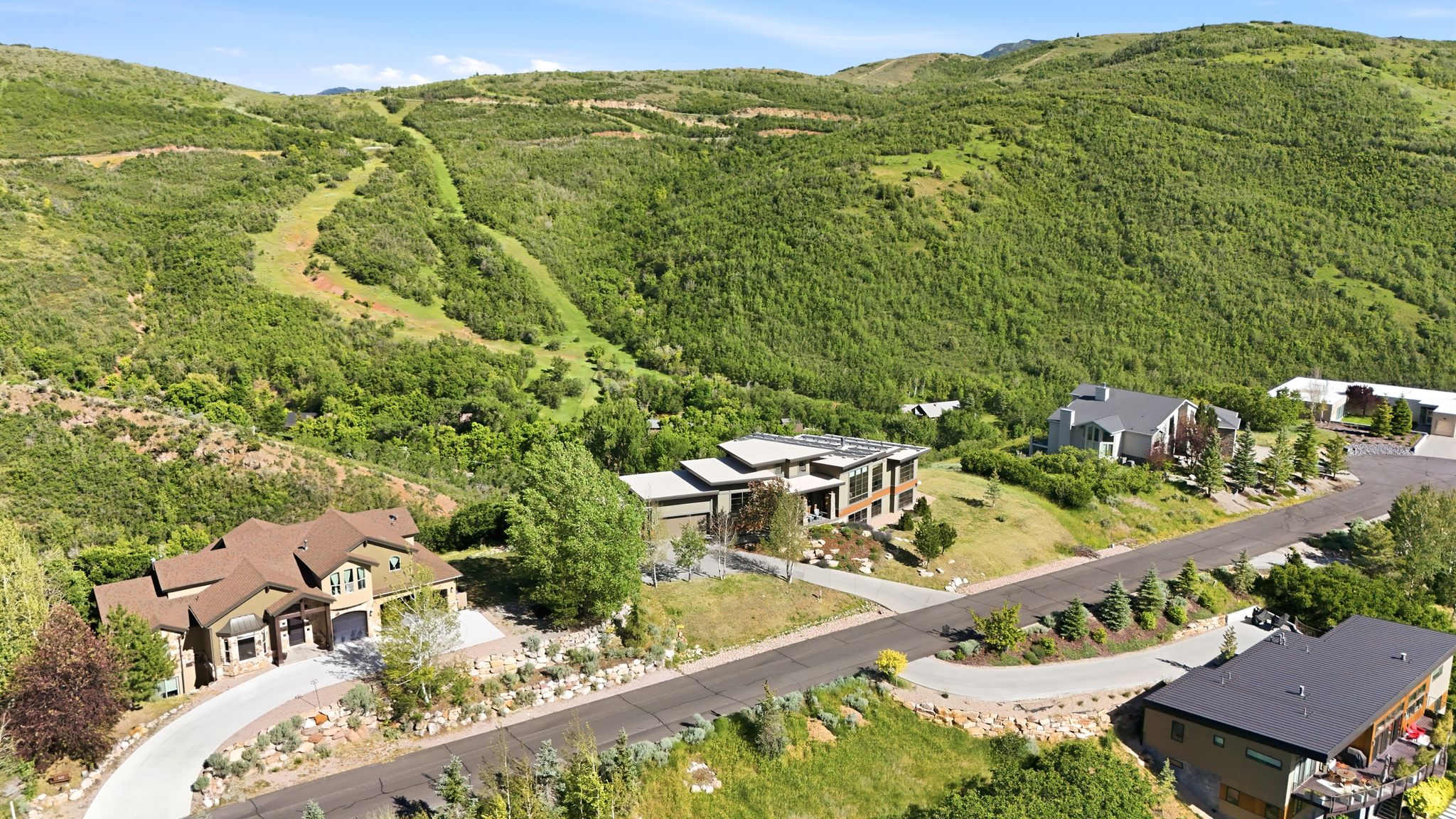 Modern architectural residence featuring a multi-level design and a flat roofline