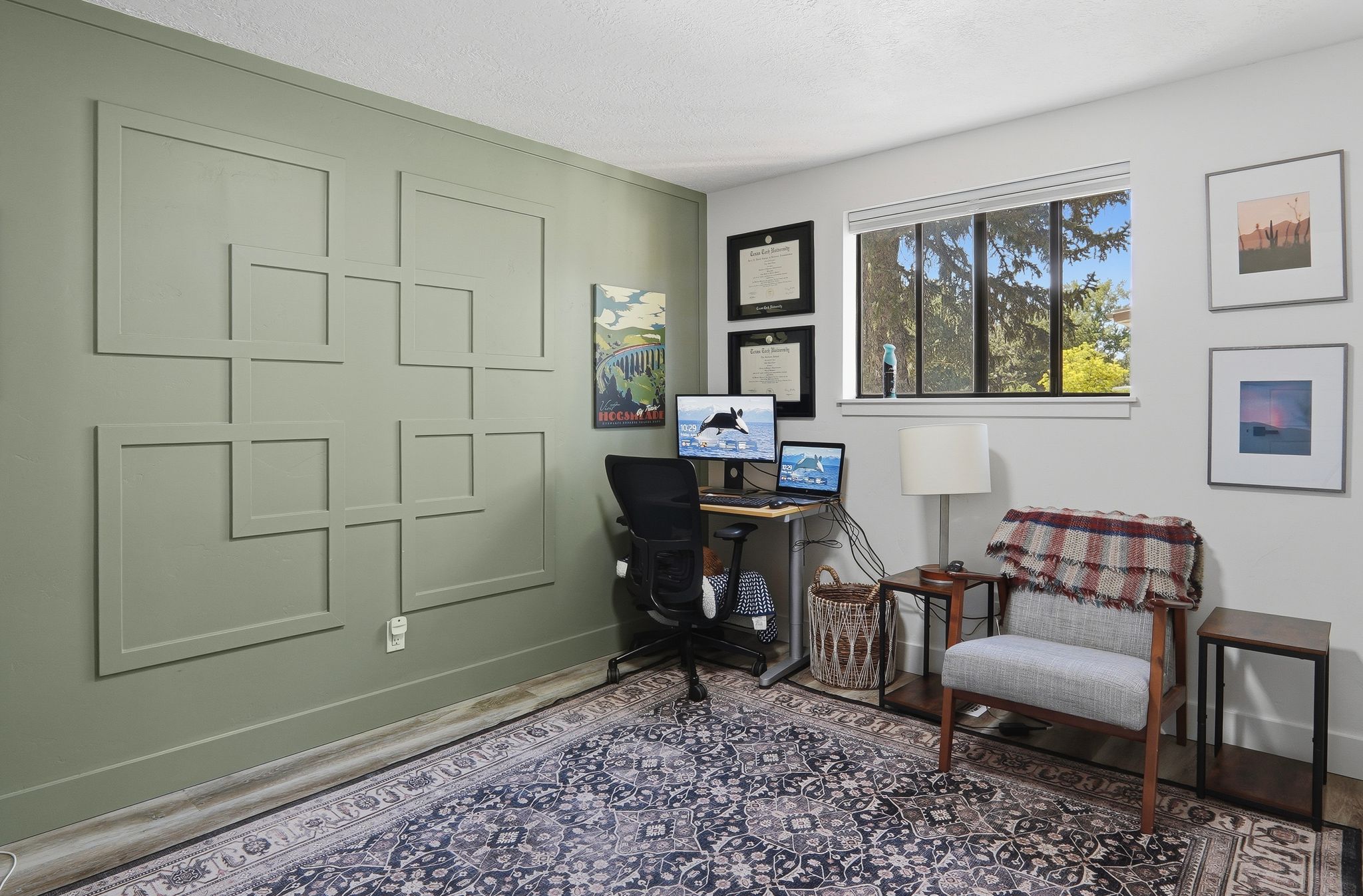 Room featuring a decorative accent wall with geometric paneling and a large window