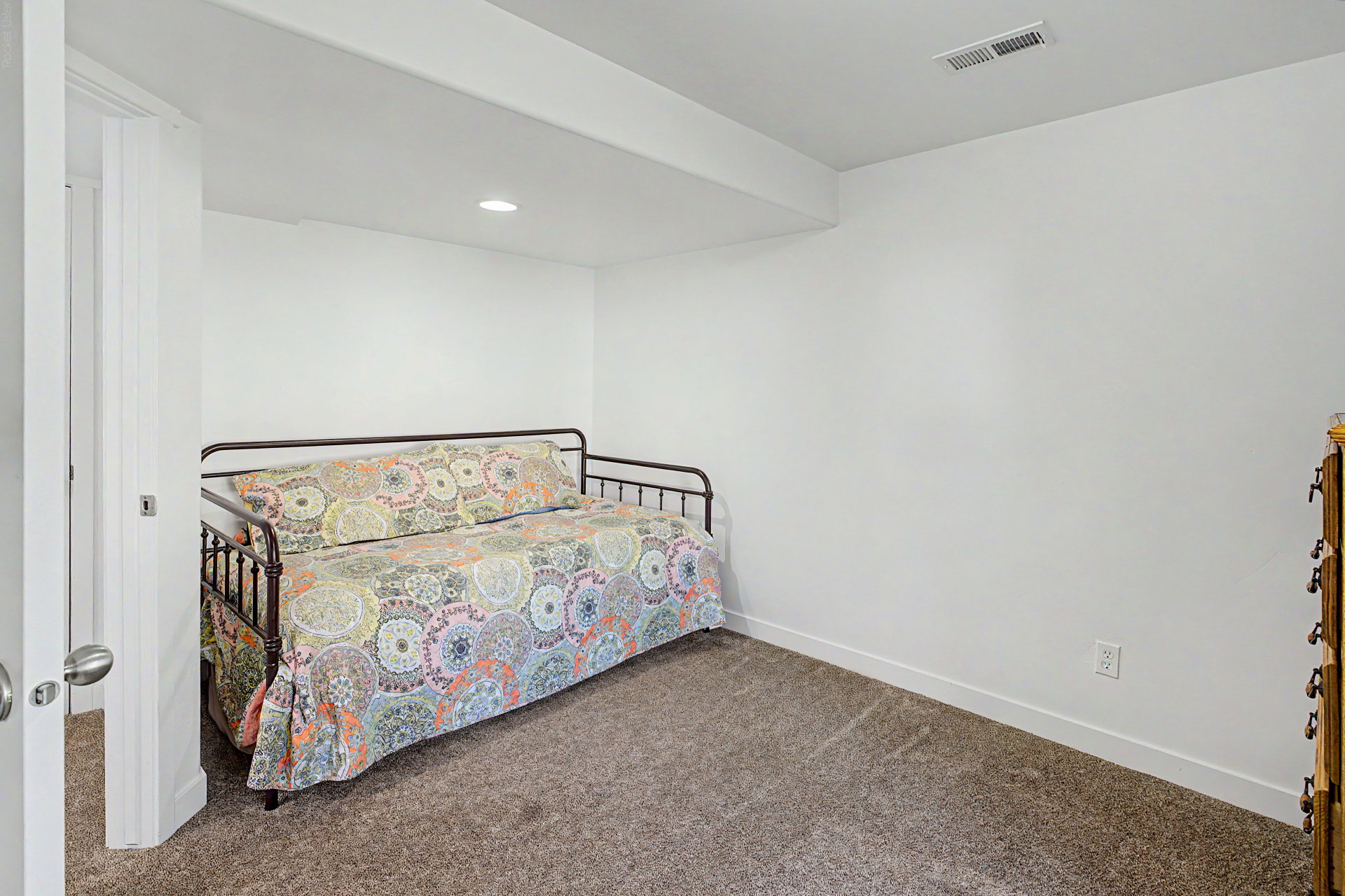 Carpeted room with white walls, recessed lighting, and white baseboards