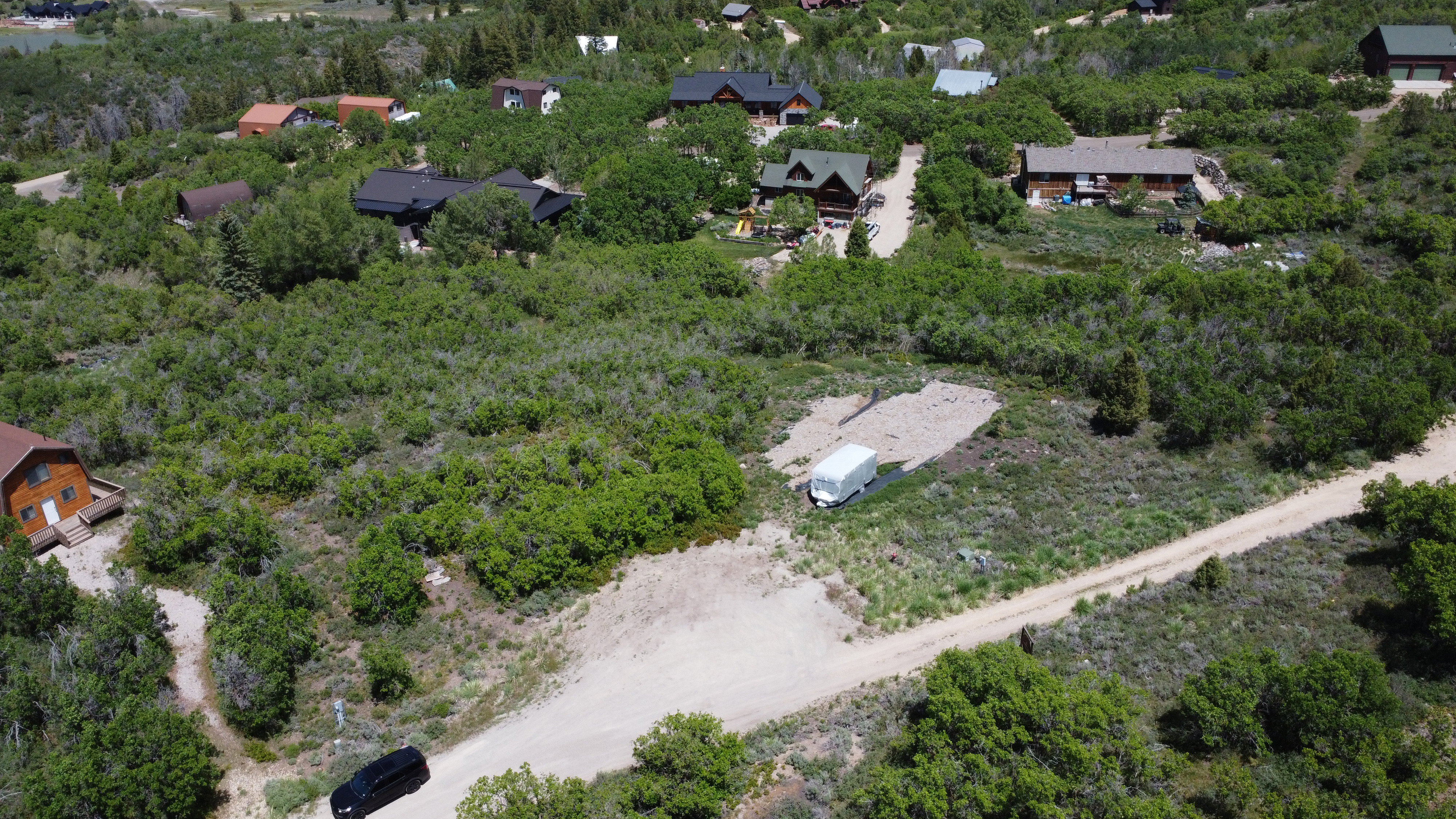 Expansive natural landscape with varied terrain and mature green foliage