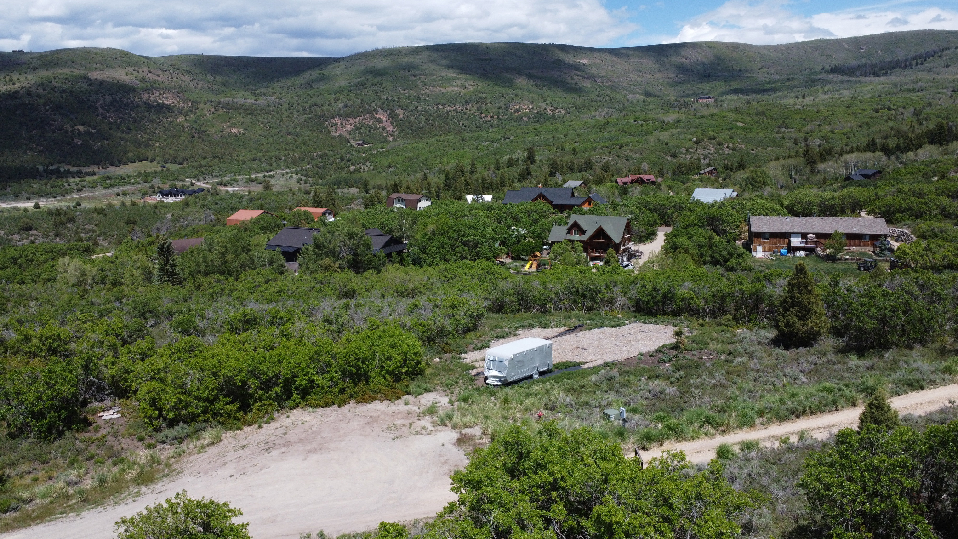 Expansive undeveloped lot featuring a natural landscape and verdant surroundings