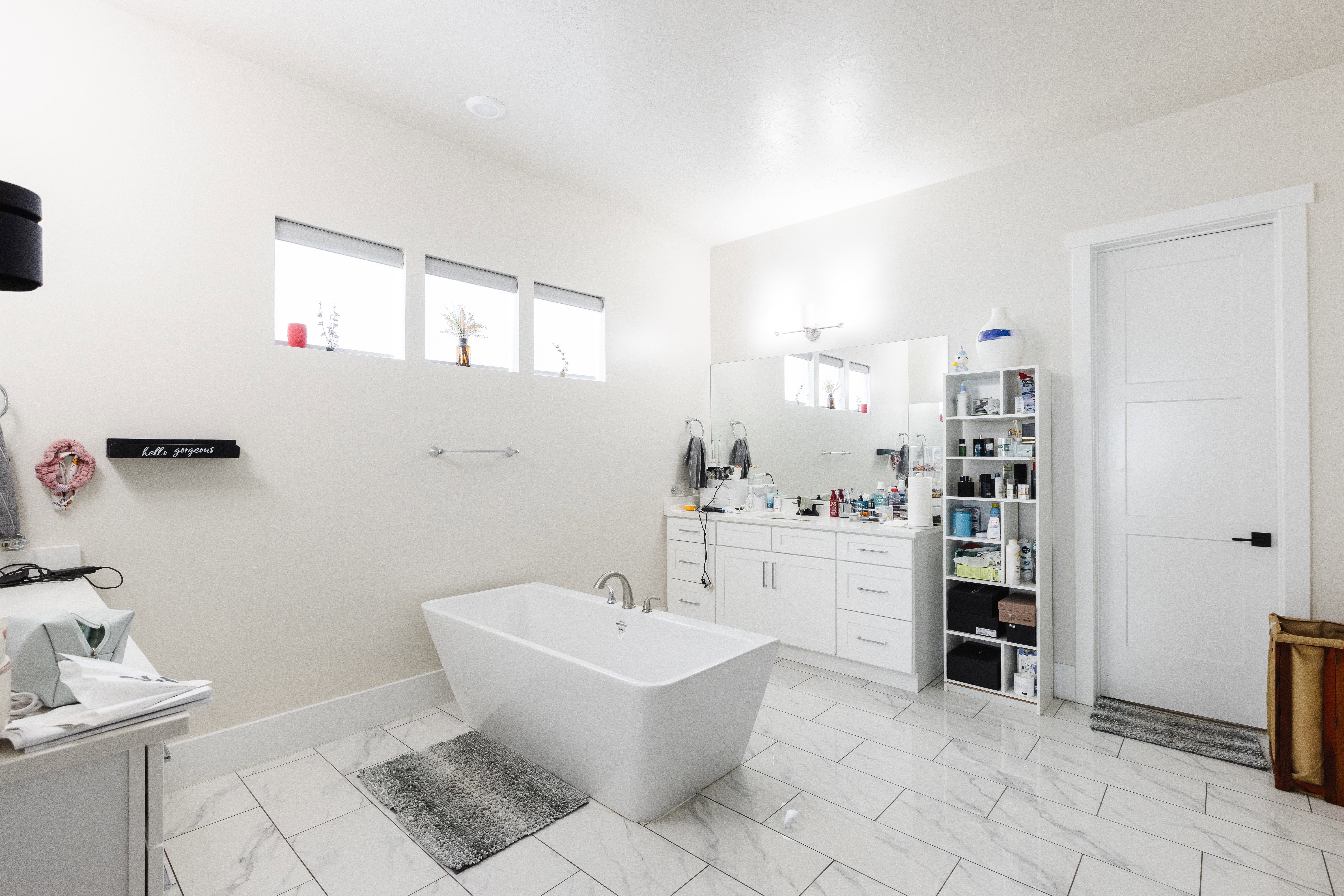 Freestanding soaking tub with floor-mounted faucet