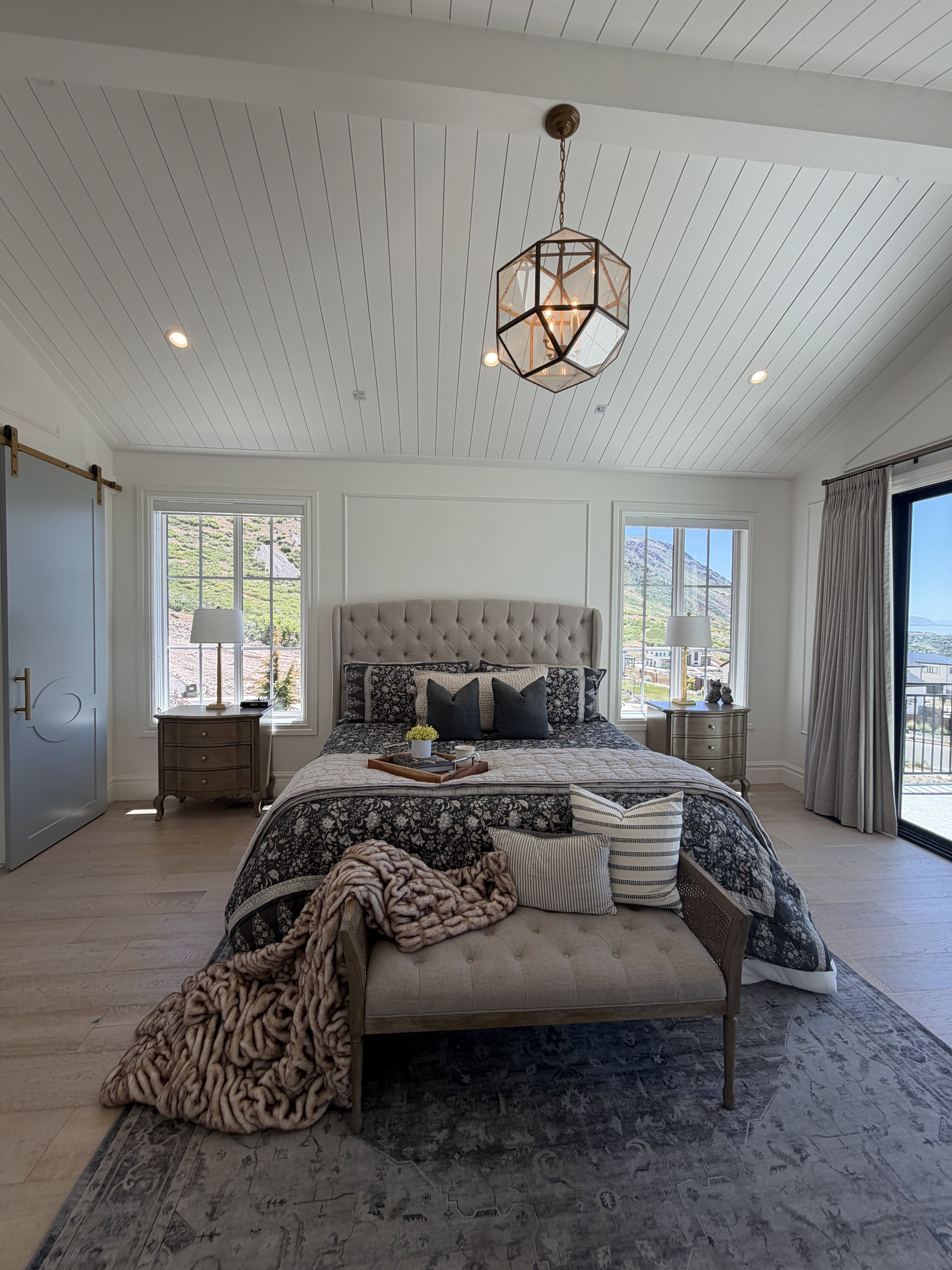 Vaulted shiplap ceiling featuring a geometric pendant light and recessed lighting