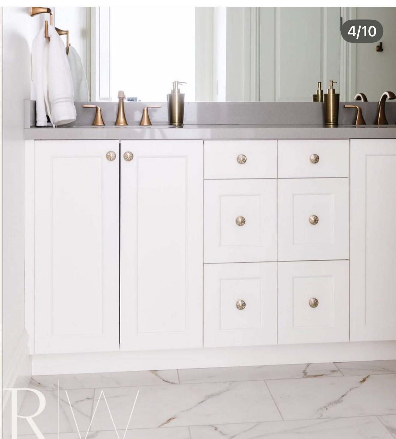 Dual vanity with white cabinetry and a gray countertop