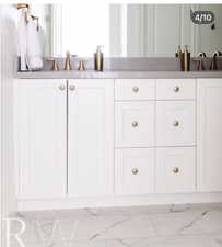 Dual vanity with white cabinetry and a gray countertop