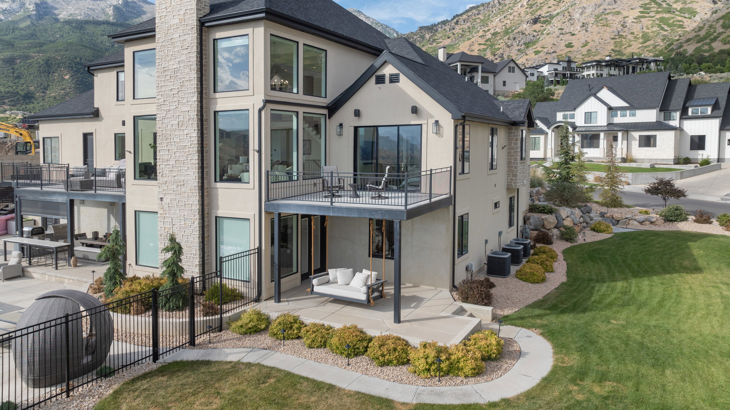 Rear exterior showcasing multiple balconies and patios