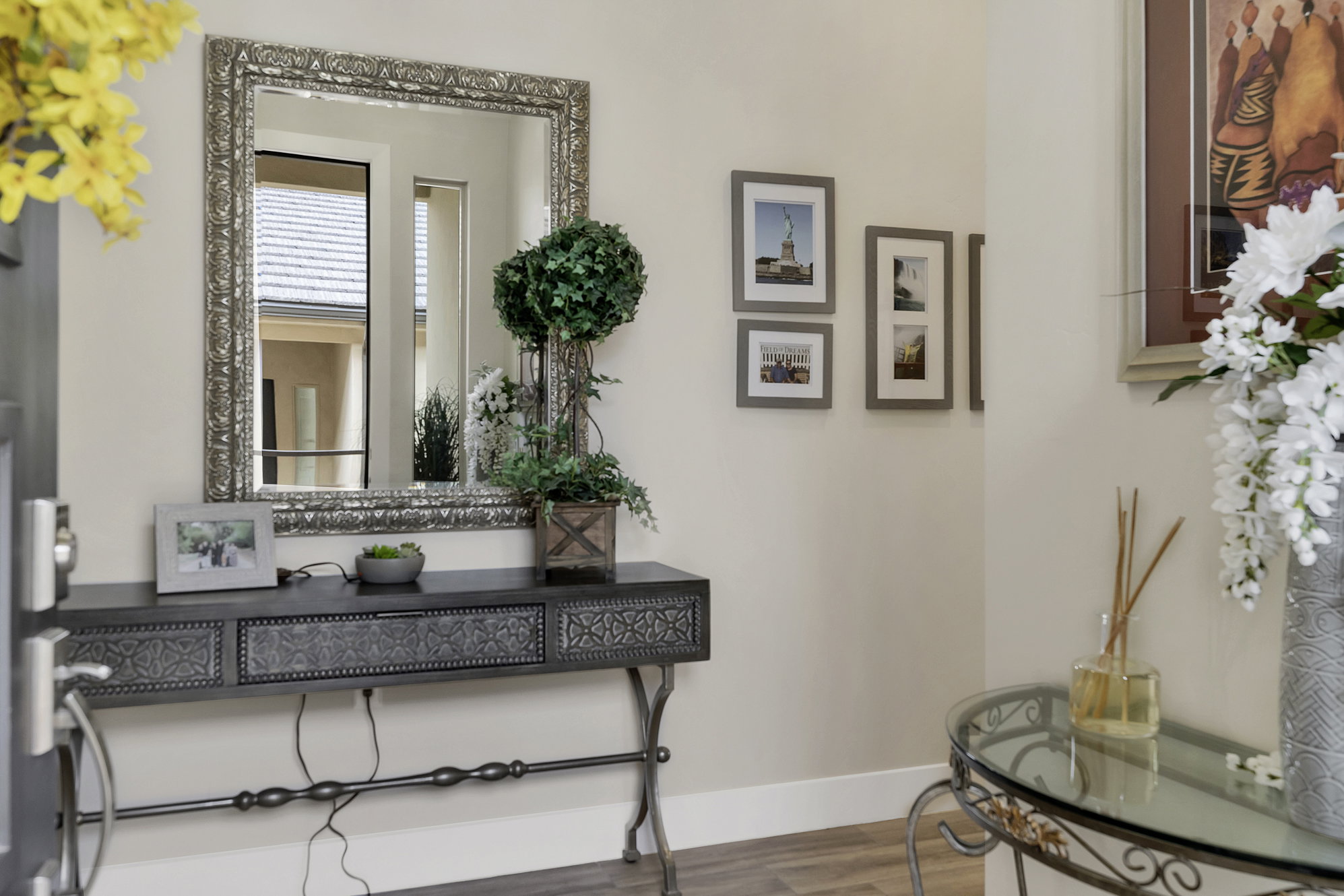 Entryway featuring a decorative console table with an ornate mirror above