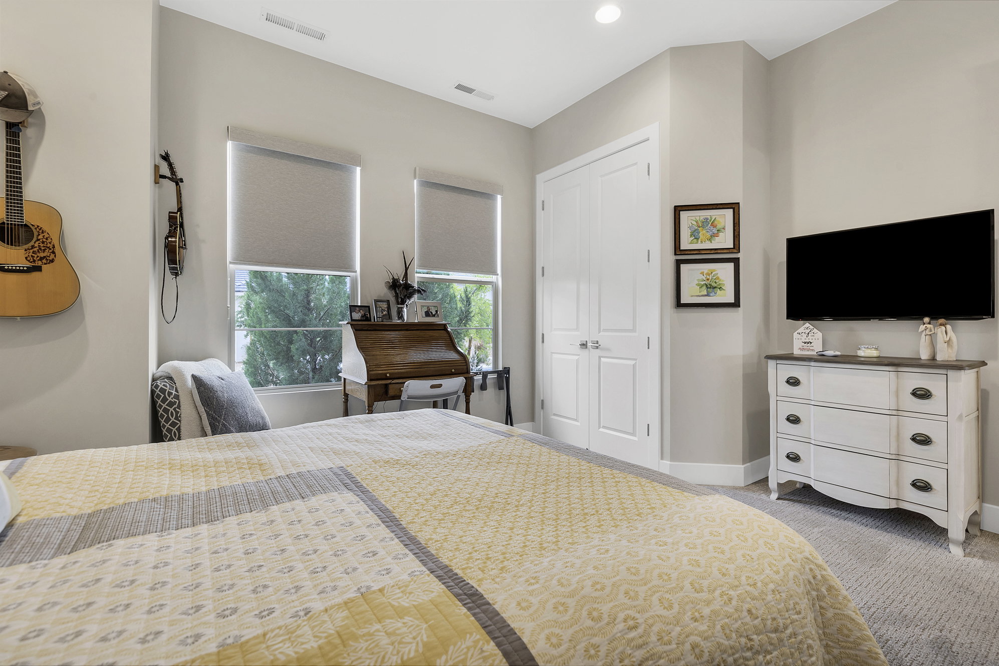 Spacious room featuring neutral-toned walls, recessed lighting, and carpet flooring