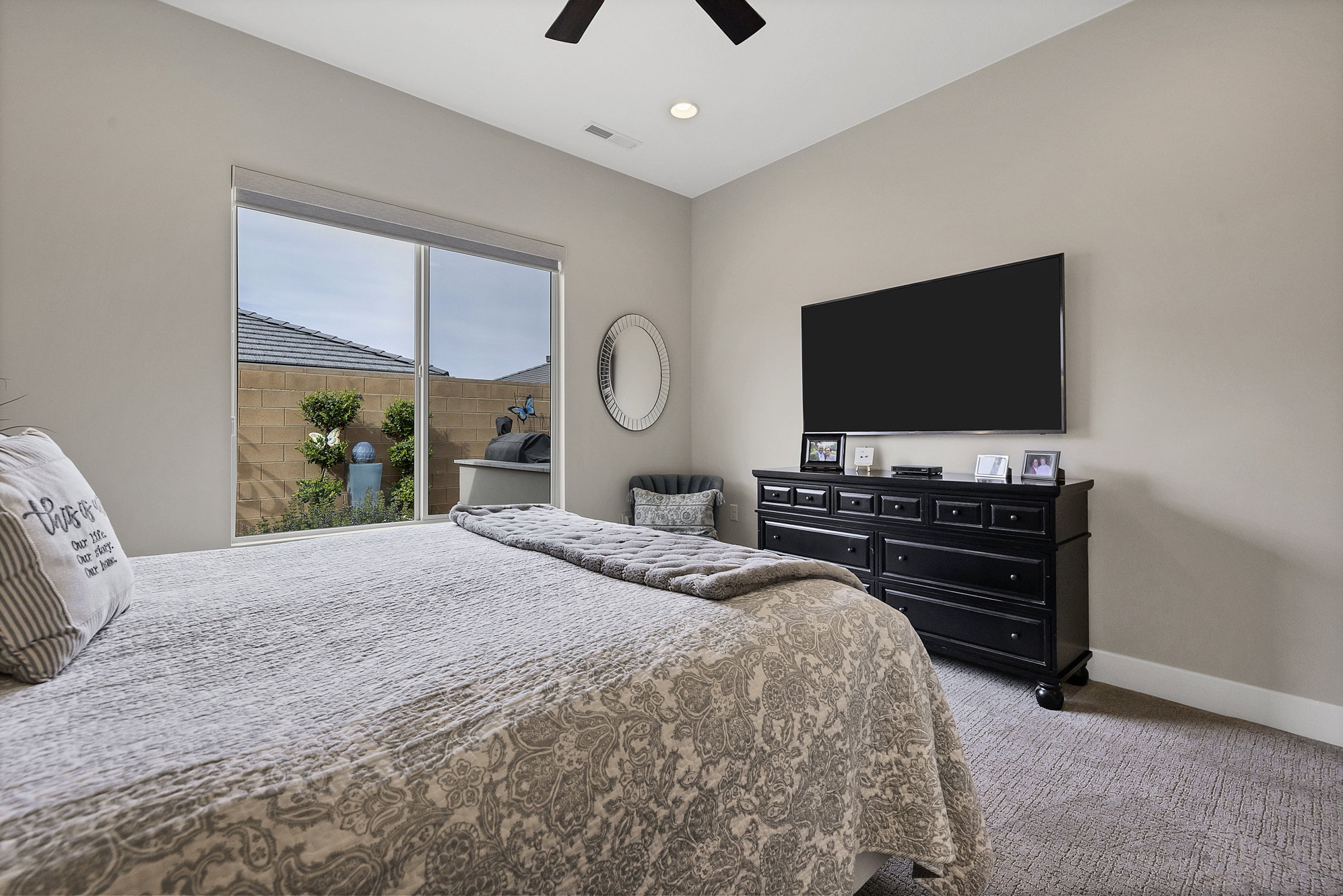 Bedroom featuring a large sliding glass door with backyard access