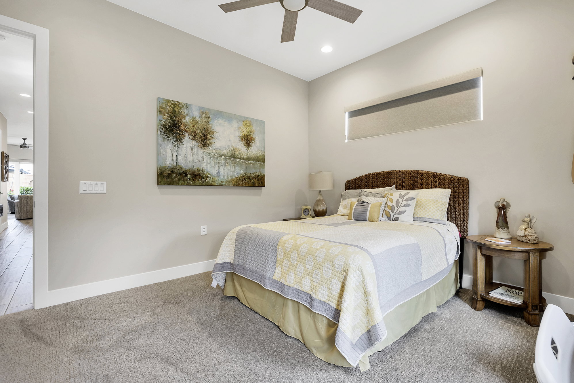 Bedroom featuring neutral carpeting, a ceiling fan, recessed lighting, and a horizontal window with a roller shade