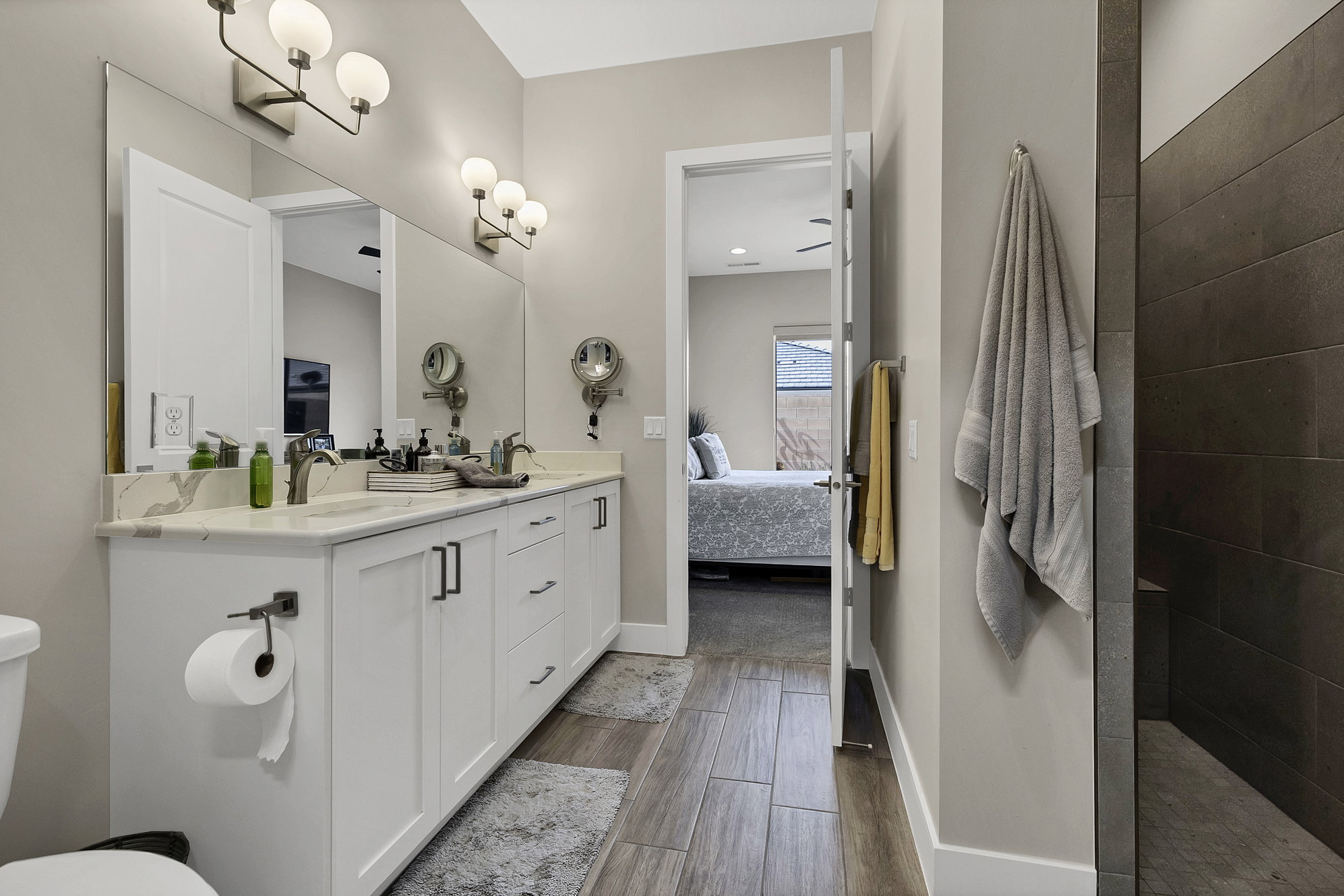 Dual vanity with a white countertop and rectangular undermount sinks