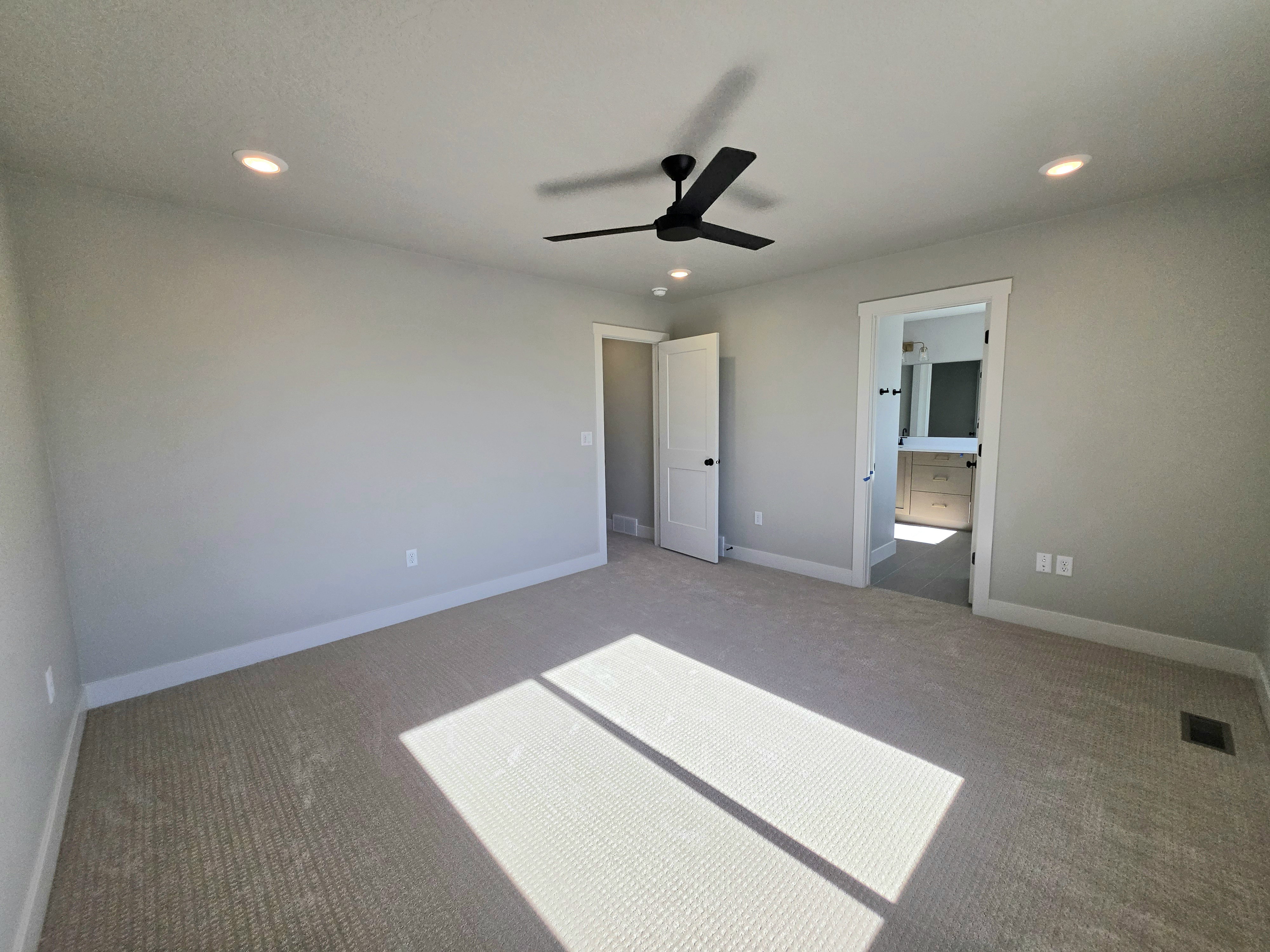 Carpeted room featuring recessed lighting and a ceiling fan