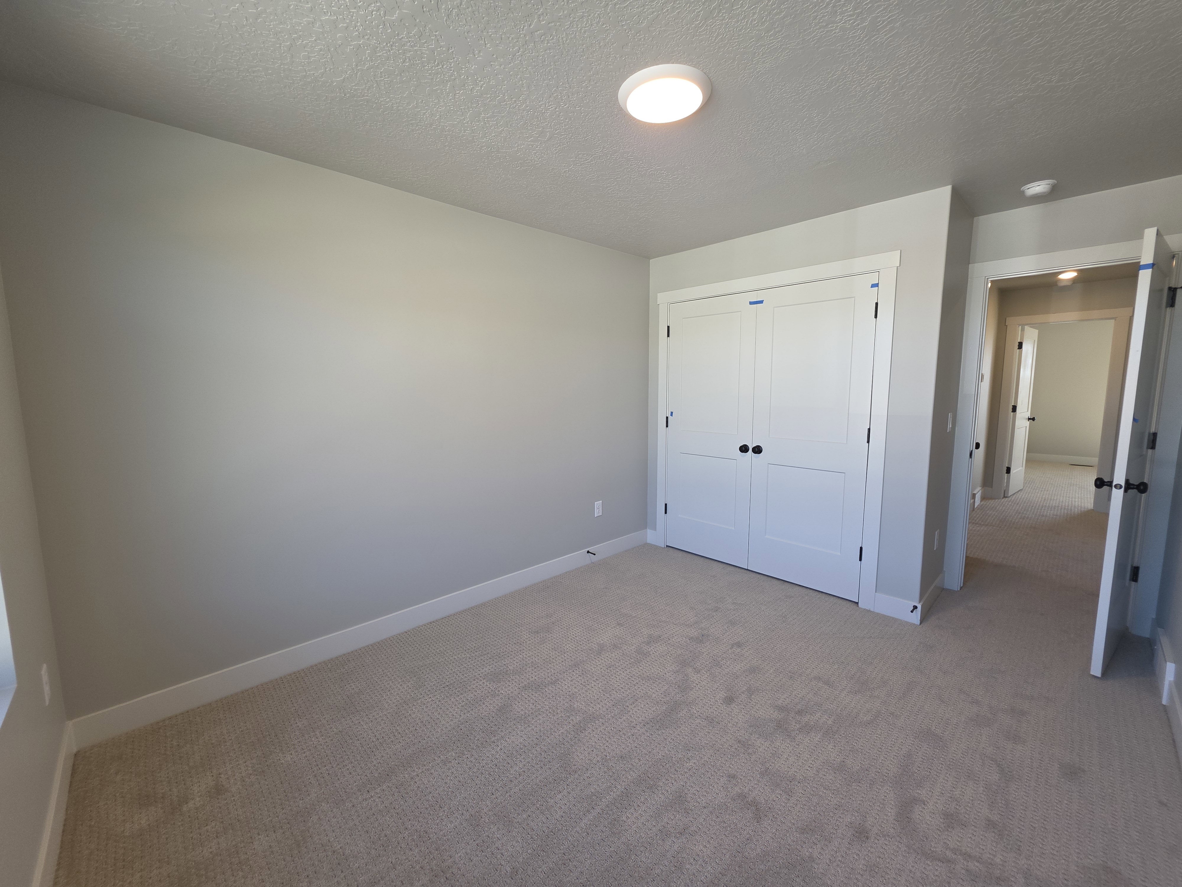 Neutral-toned carpeting throughout