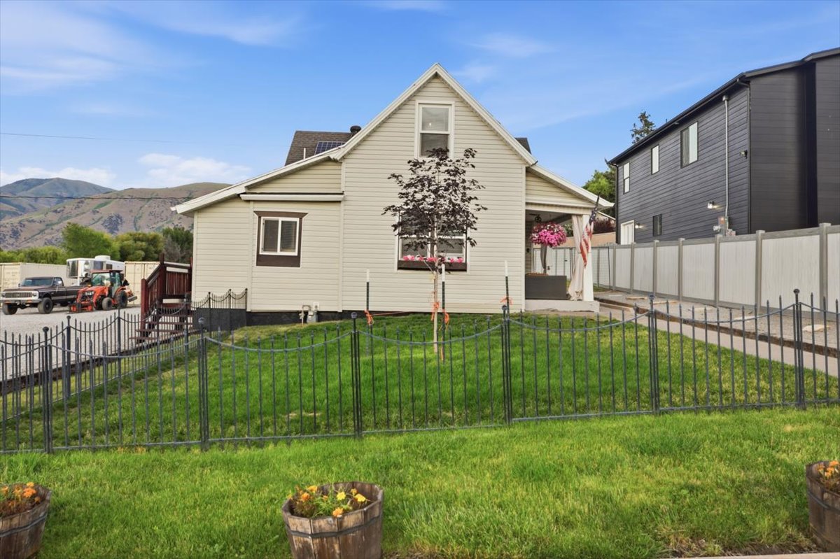 Cream-colored siding exterior with dark trim accents