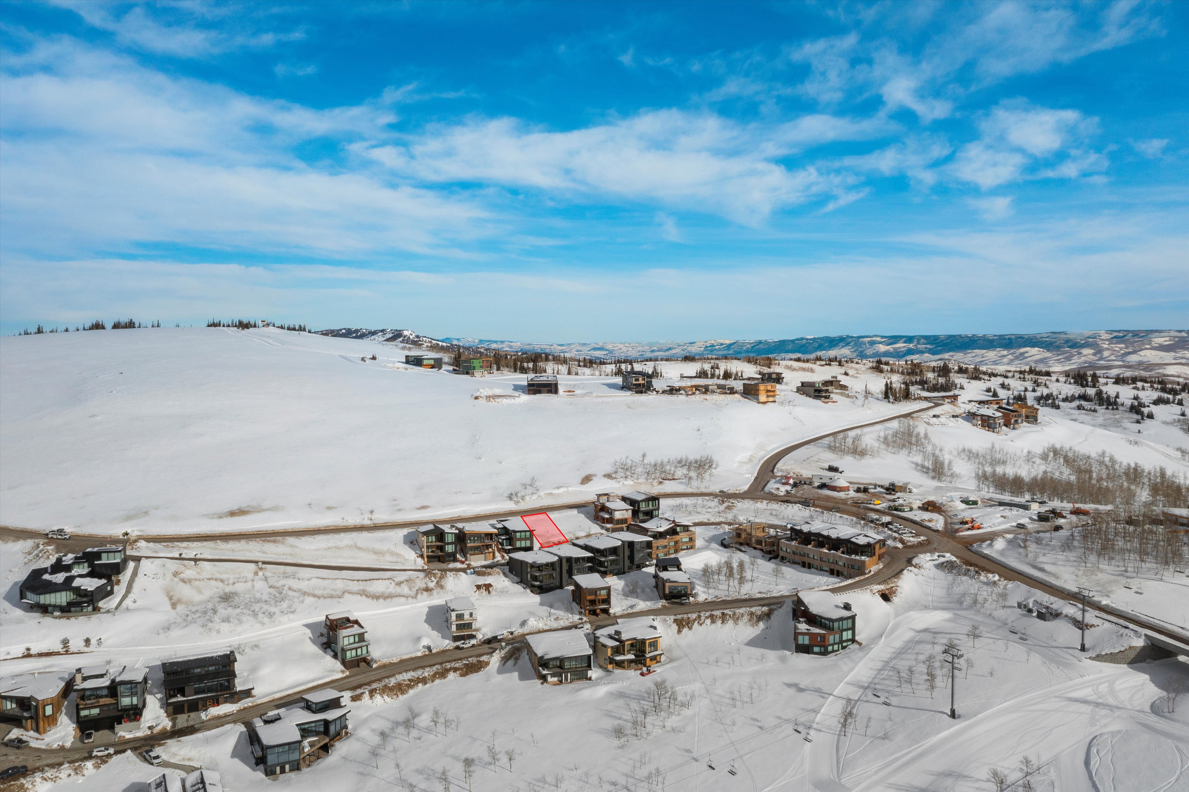 Snowy aerial view with a mountain view