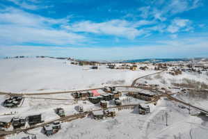 Snowy aerial view with a mountain view