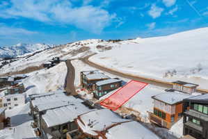 Snowy aerial view featuring a mountain view