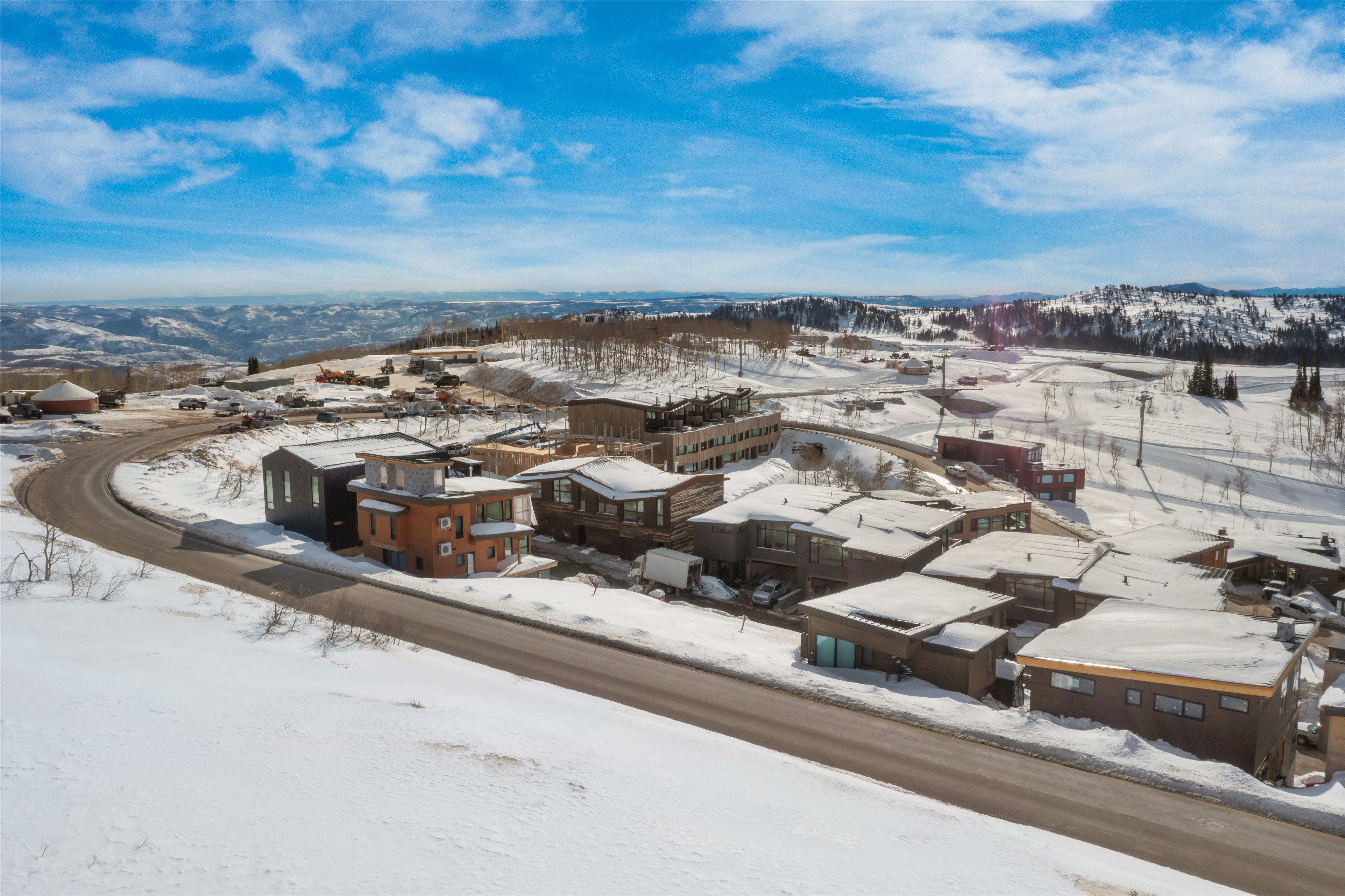Snowy aerial view with a residential view and a mountain view