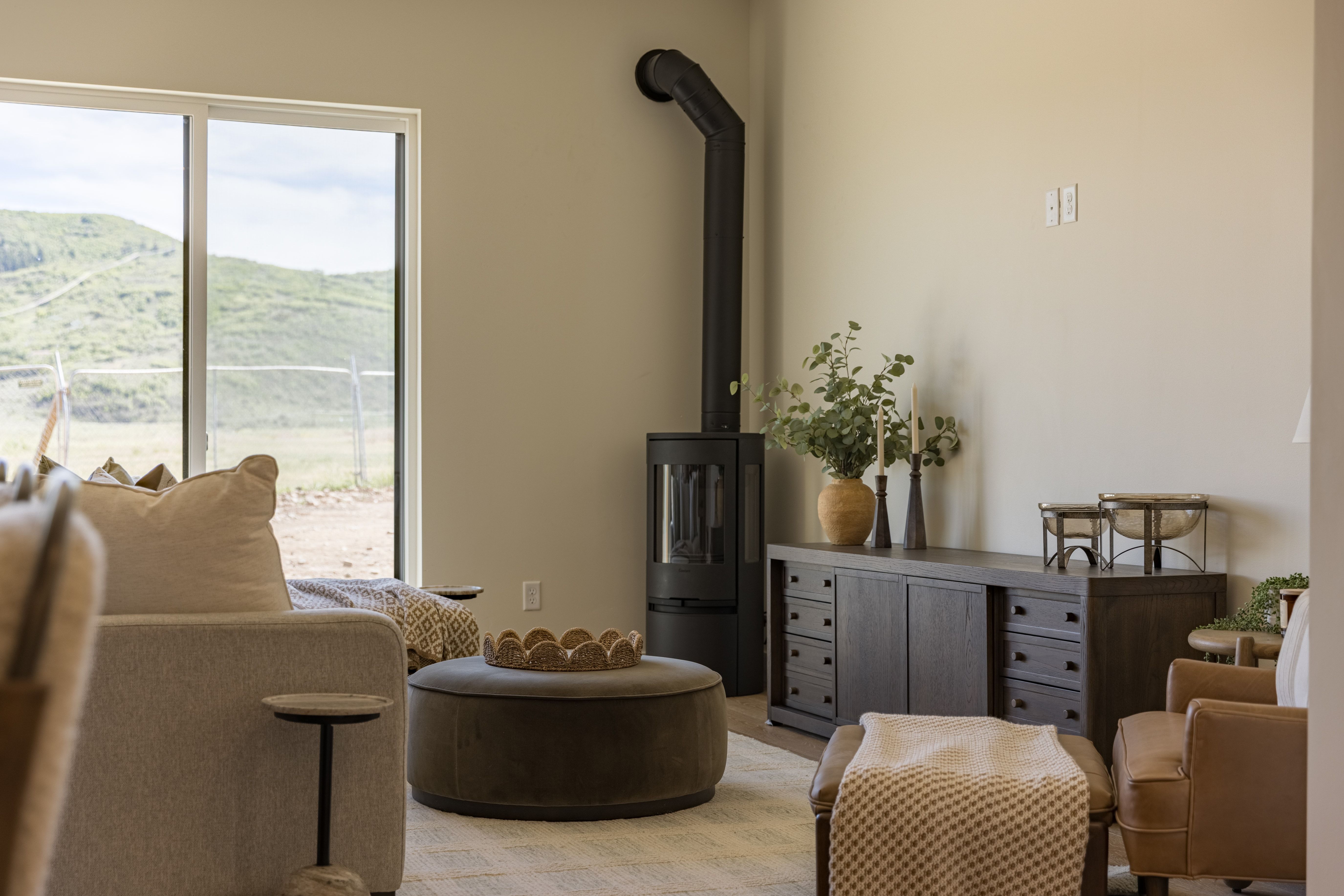 Contemporary black wood-burning stove with visible flue