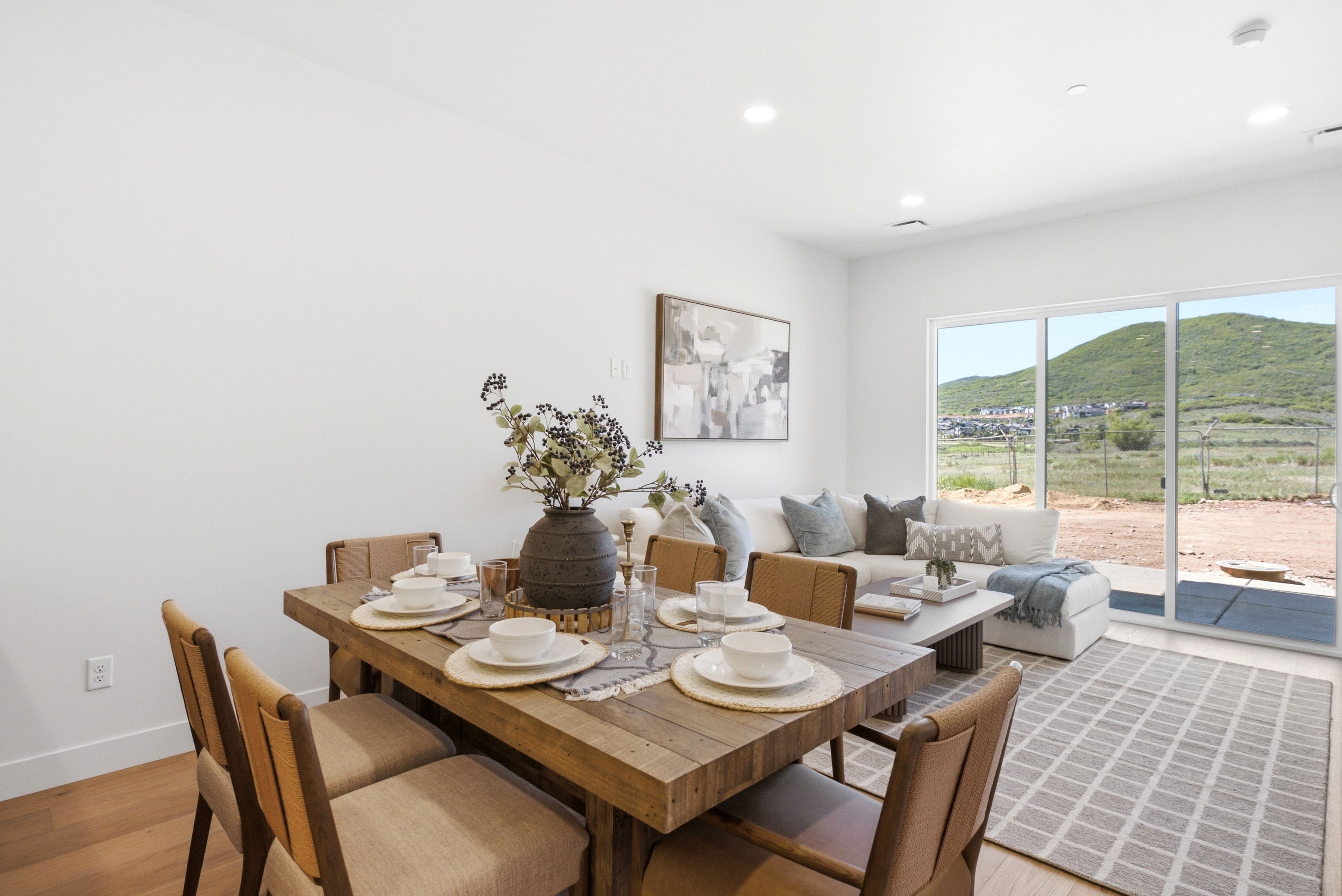 Open concept living area with light wood-finish flooring