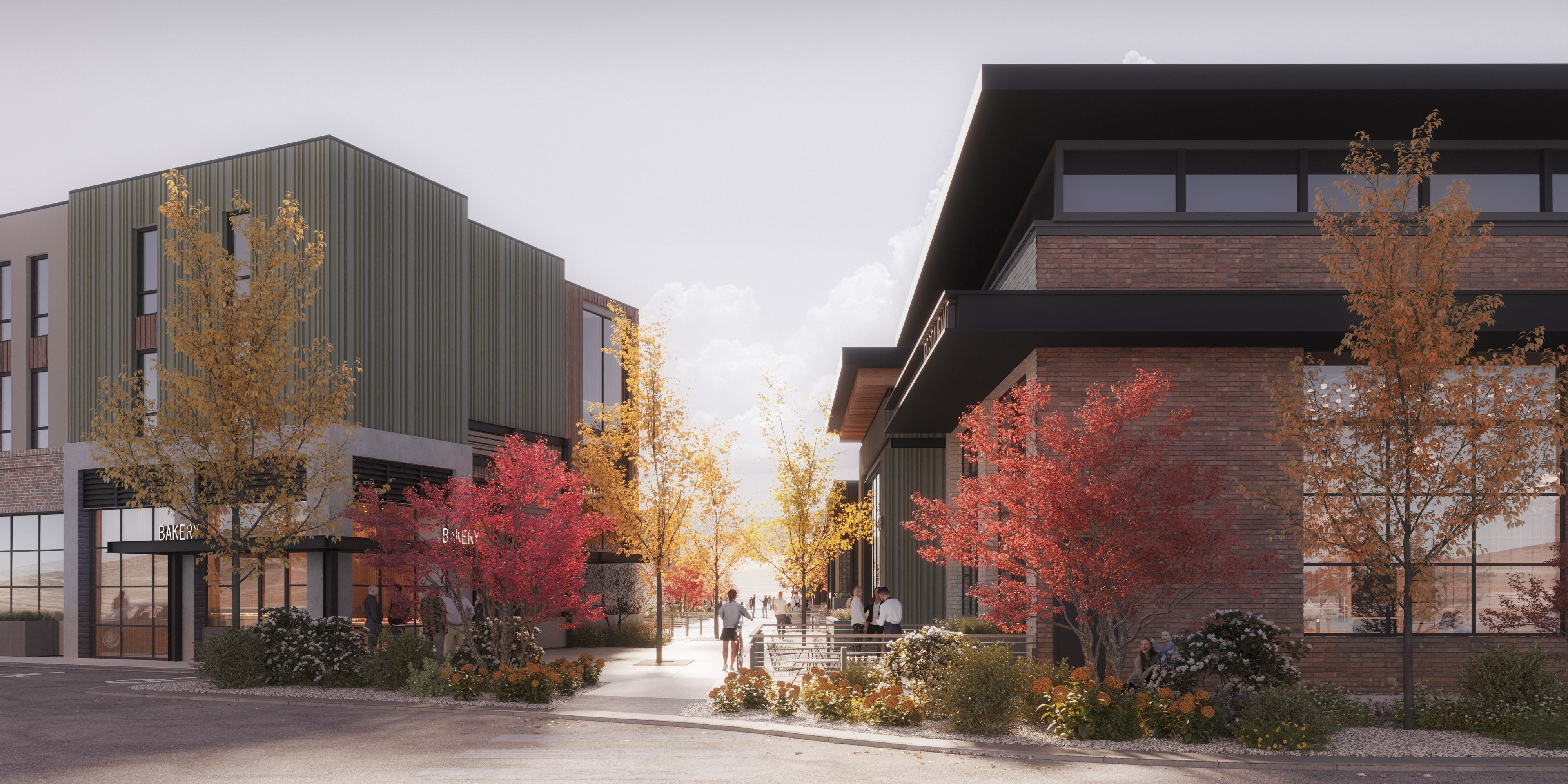 Modern commercial architecture featuring a brick and corrugated metal facade, expansive windows, and a pedestrian walkway