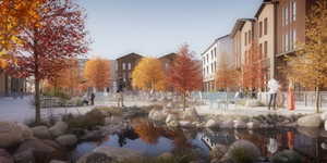 Community space featuring a central water feature surrounded by rock landscaping and established trees