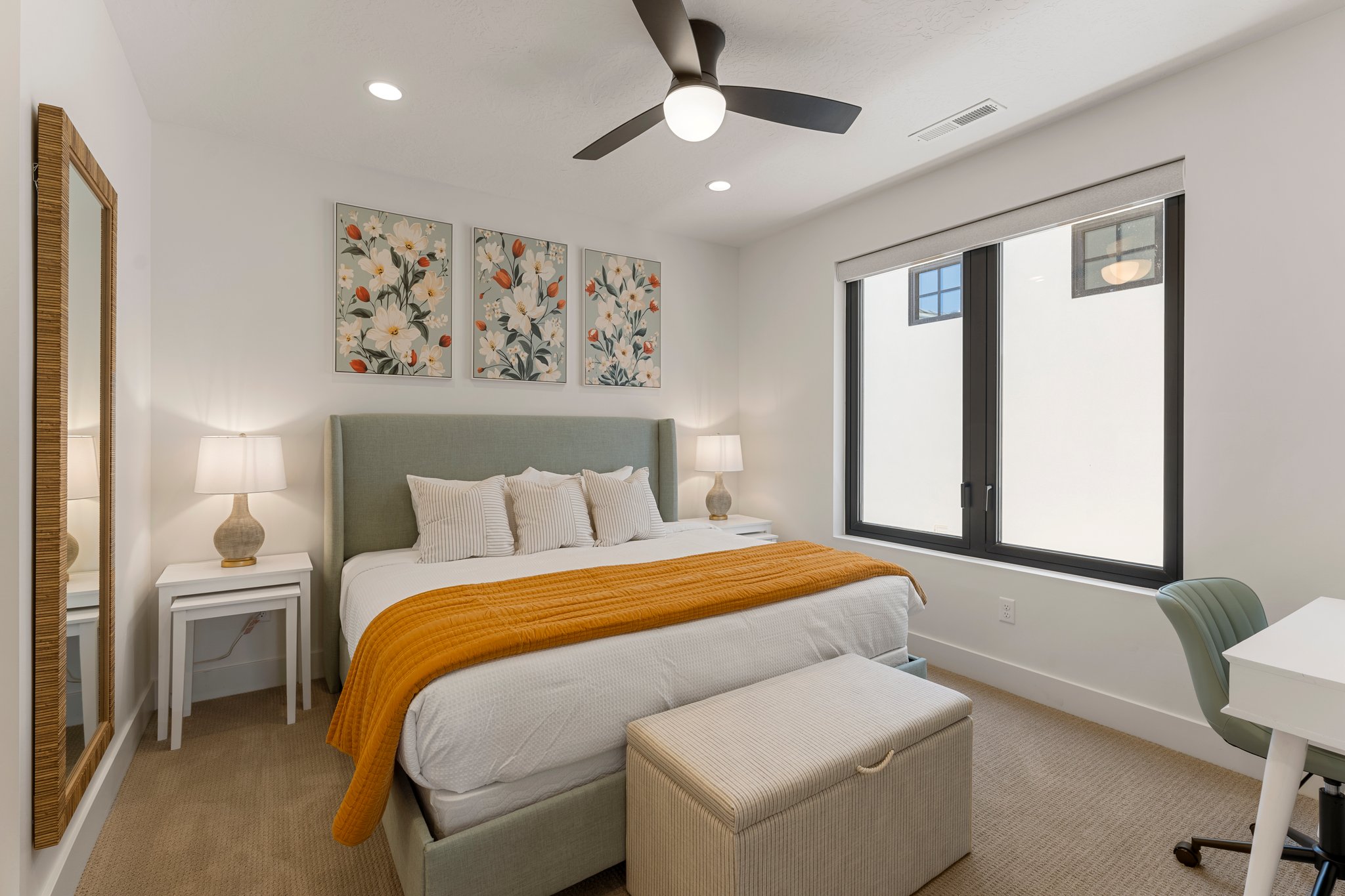 Bedroom featuring a multi-pane window with dark trim, recessed lighting, and a ceiling fan