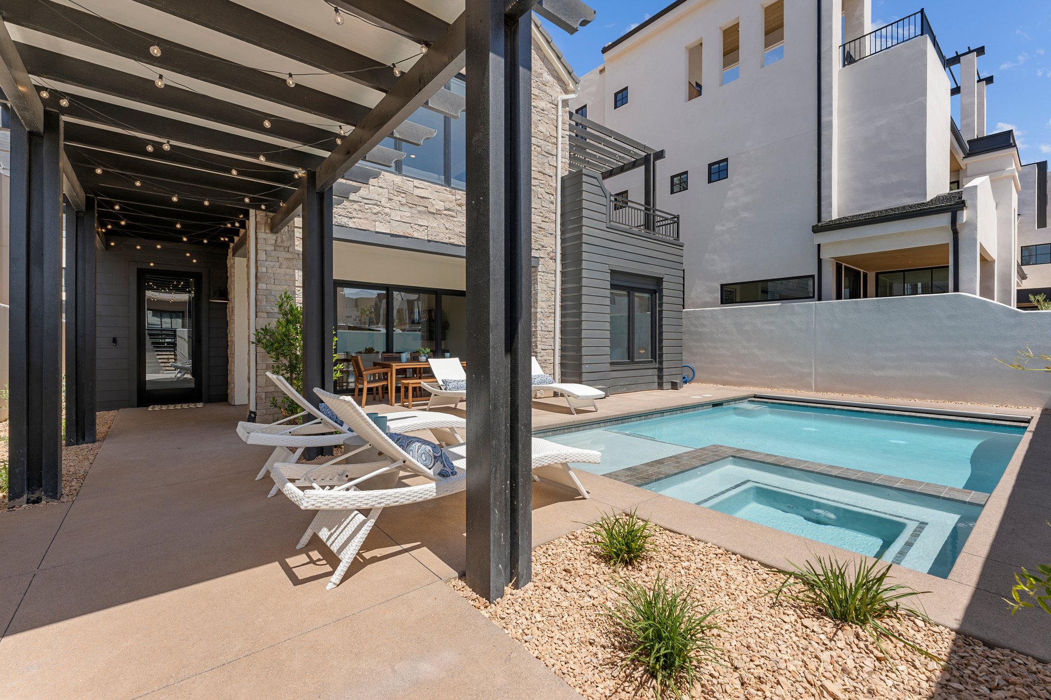 Private courtyard featuring a swimming pool with integrated spa