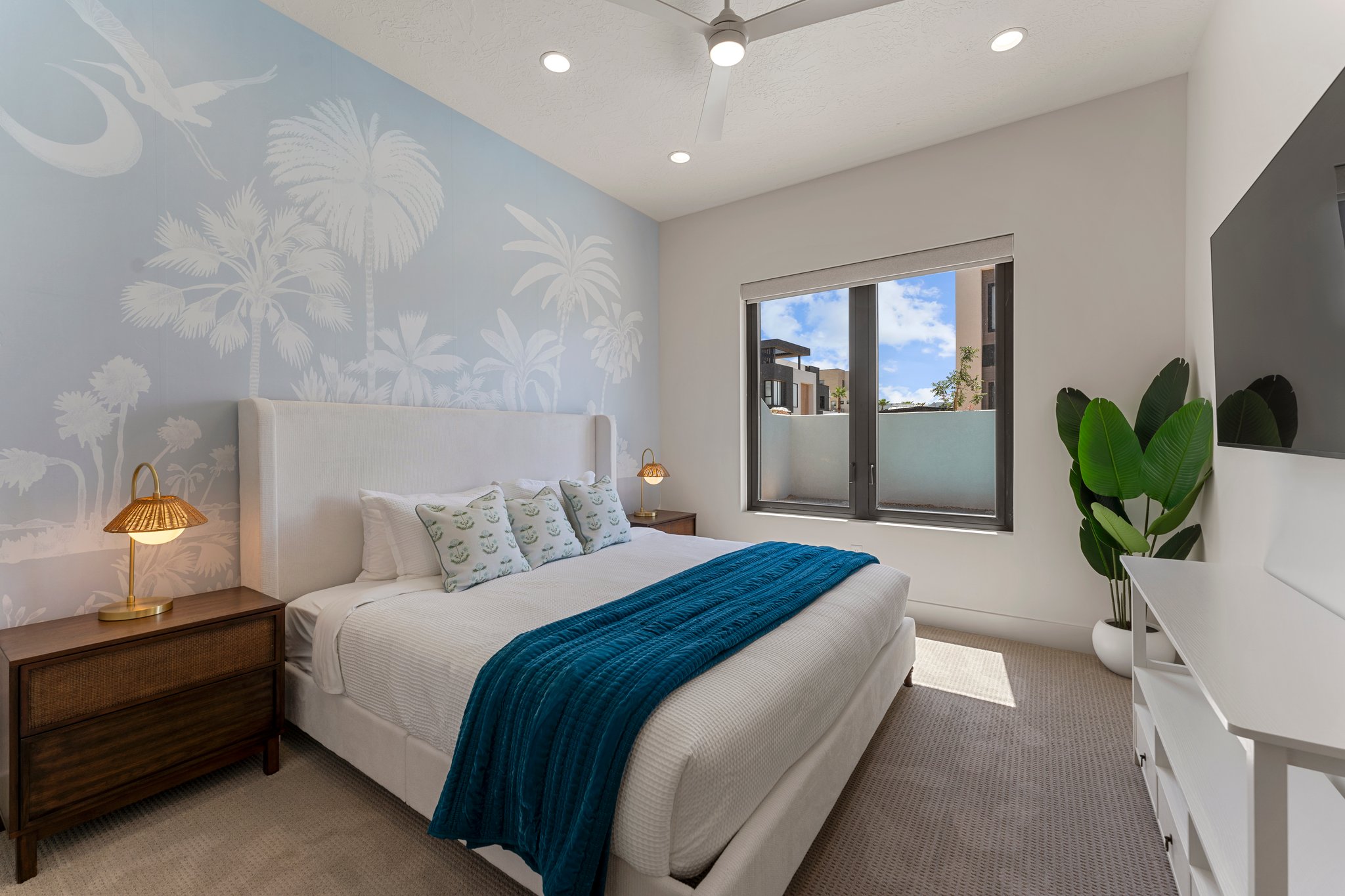 Bedroom featuring a light blue mural accent wall, recessed lighting, and a ceiling fan