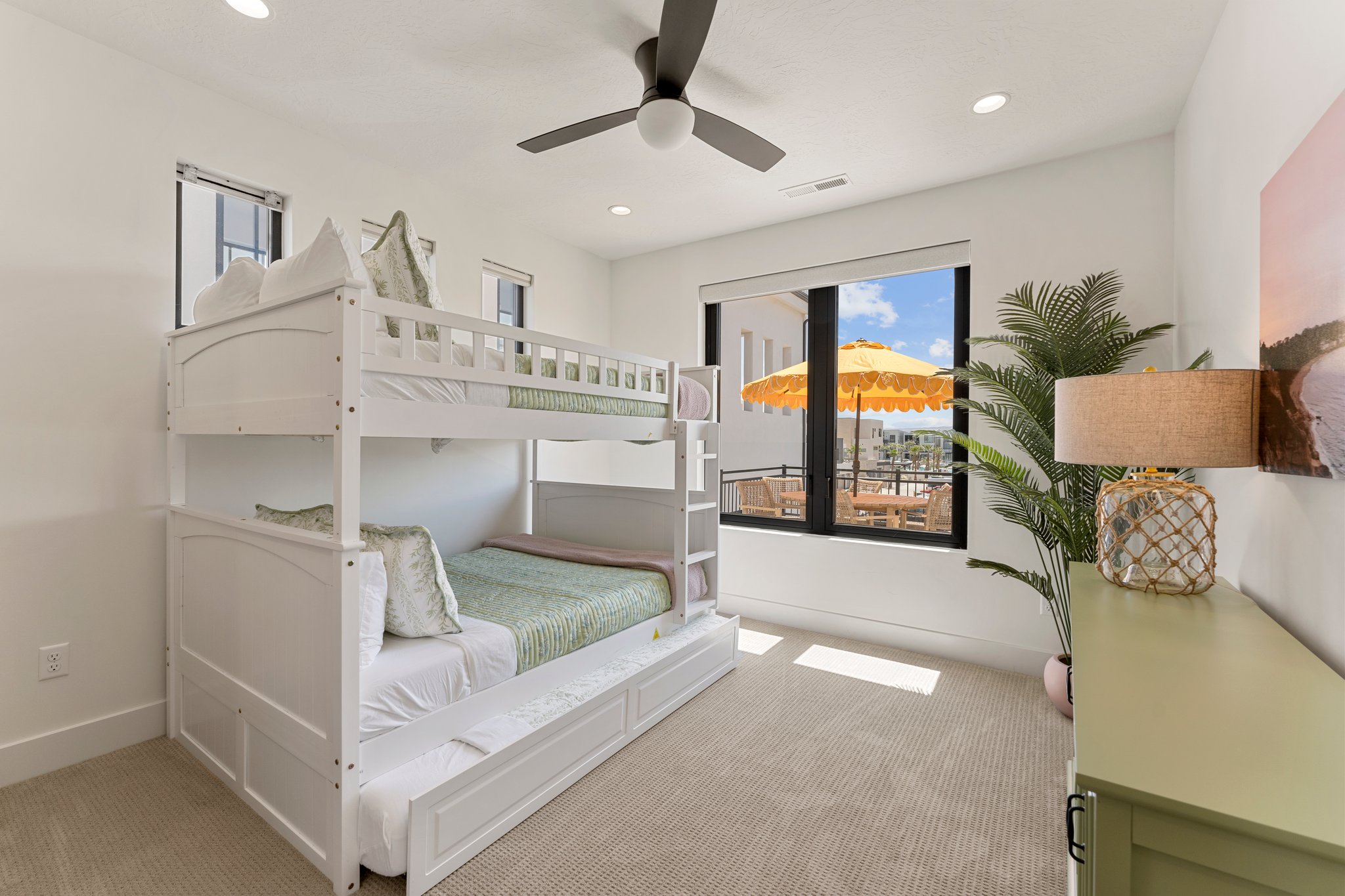 Room featuring a white bunk bed with a trundle, recessed ceiling lights, and a ceiling fan