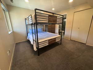 Carpeted room with recessed lighting and a window ledge