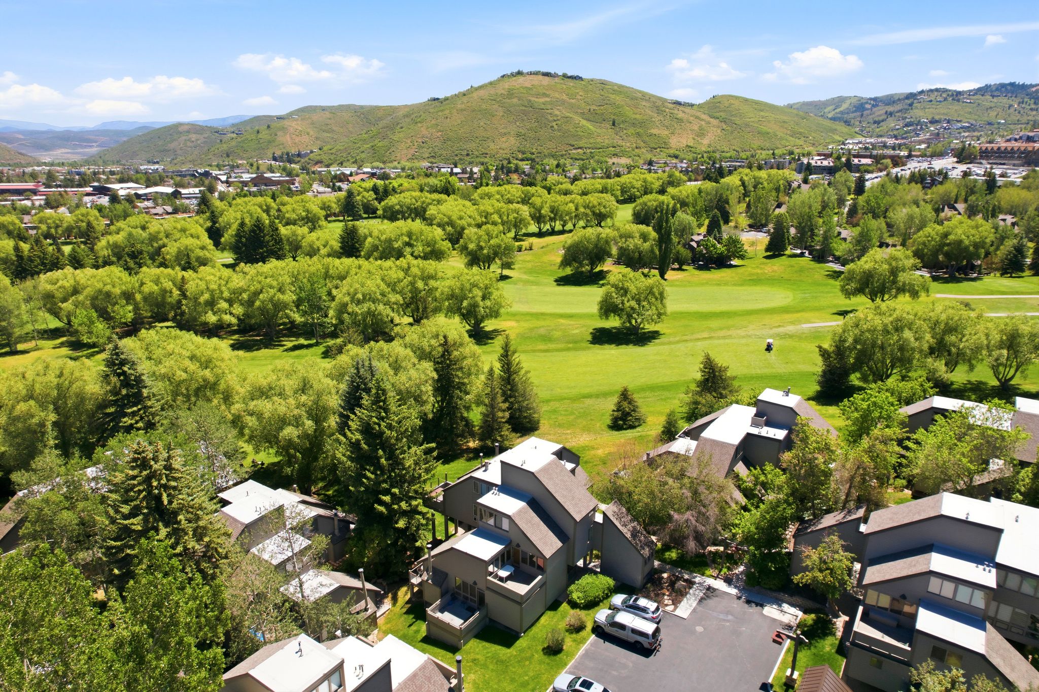 Aerial perspective showcasing modern multi-level properties with ample parking