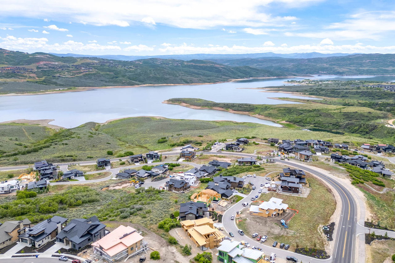 Aerial perspective showcasing a residential development with extensive water frontage