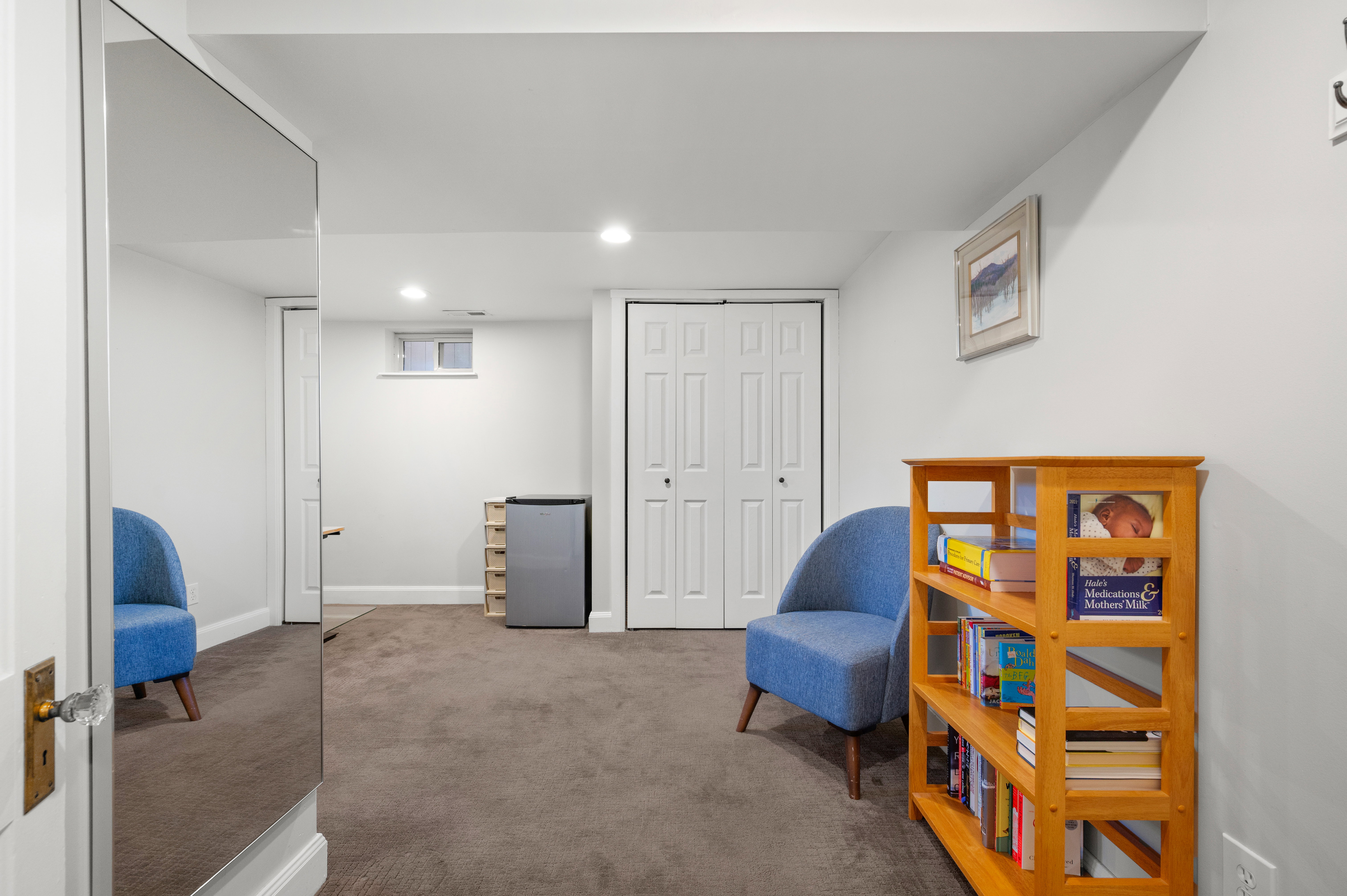 Carpeted room featuring recessed lighting, a window, and bifold closet doors