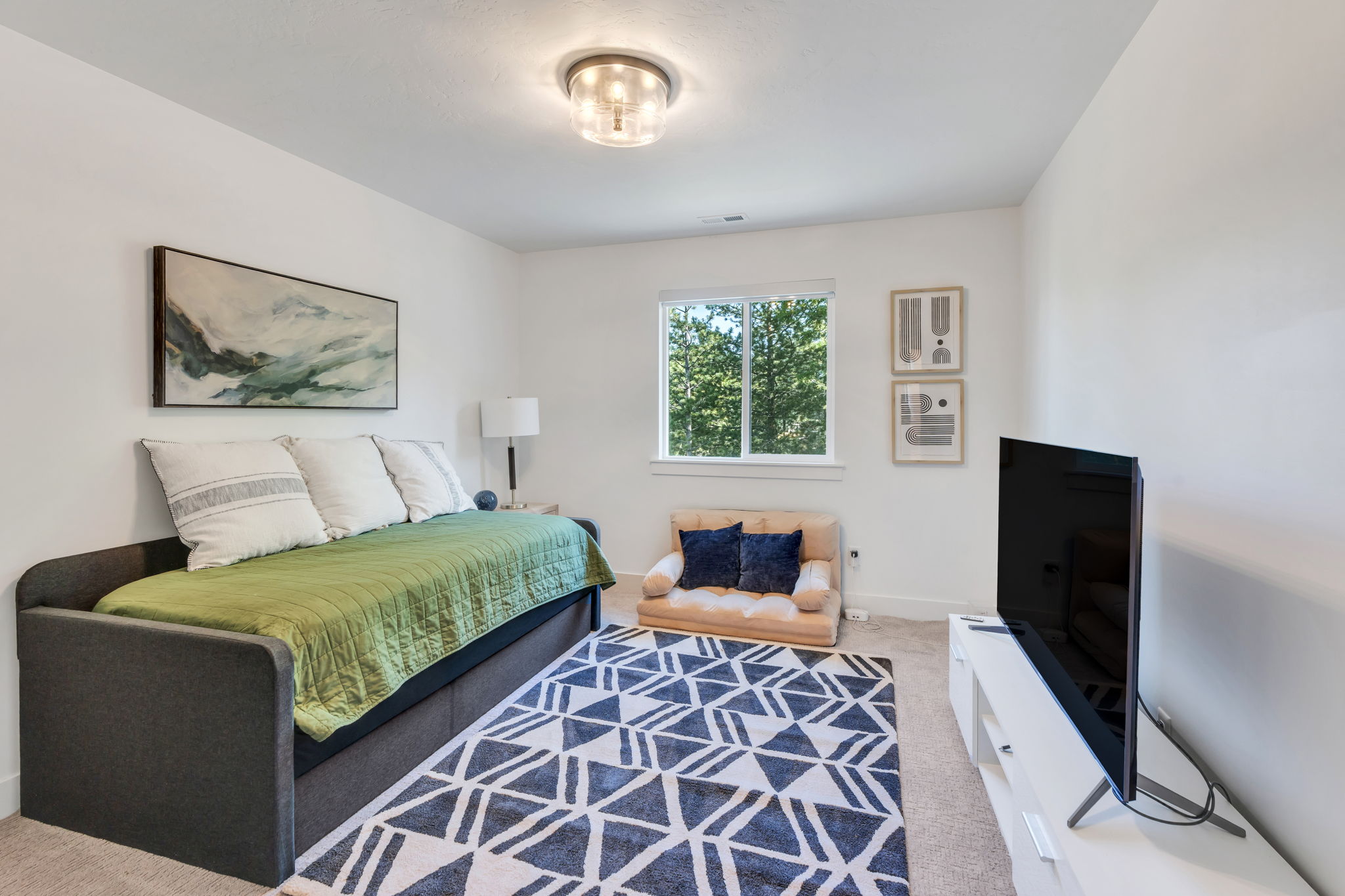 Bright interior space featuring a double-paned window, neutral wall paint, recessed lighting, and soft carpet flooring