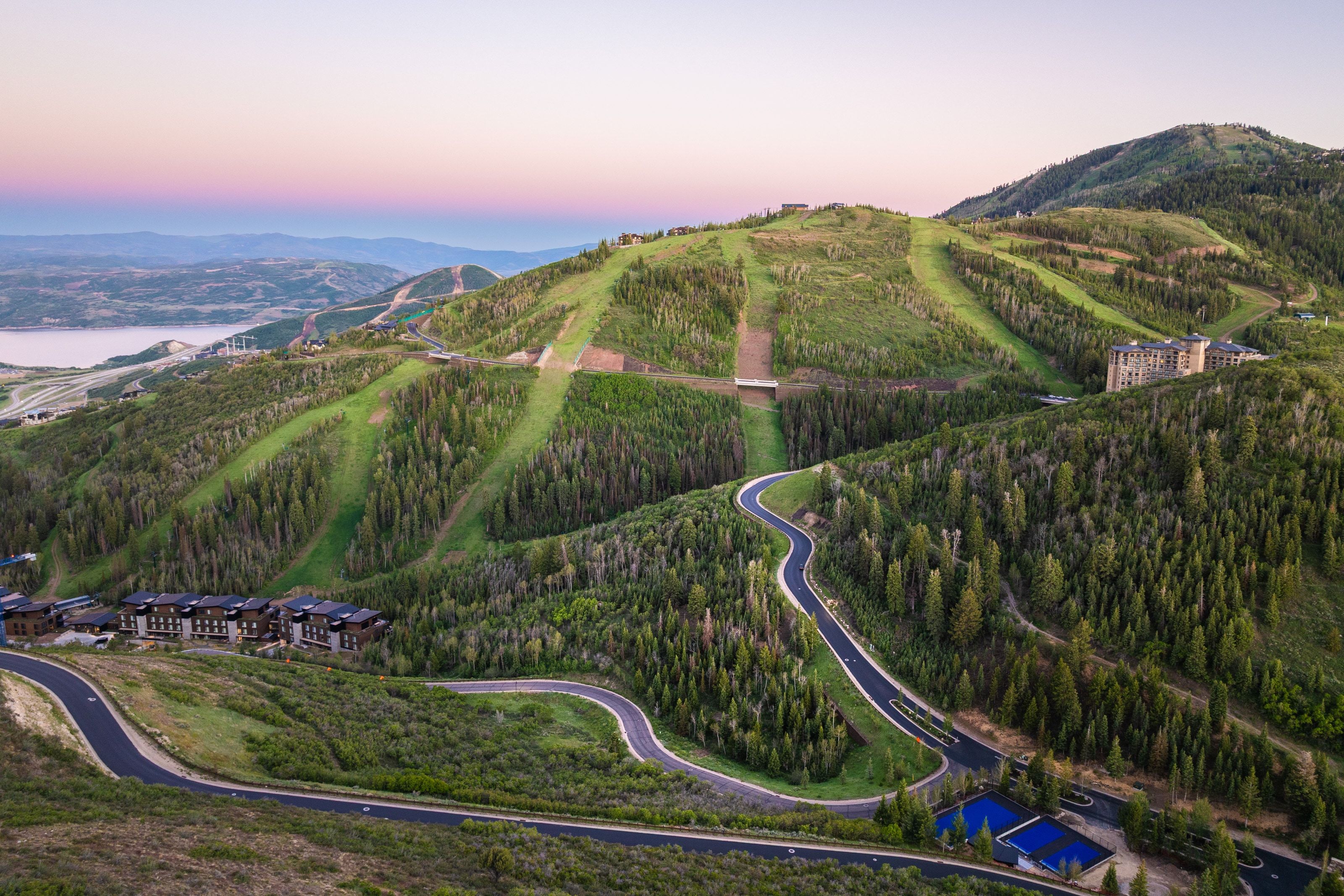 Aerial perspective showcasing a mountain landscape with multiple ski runs