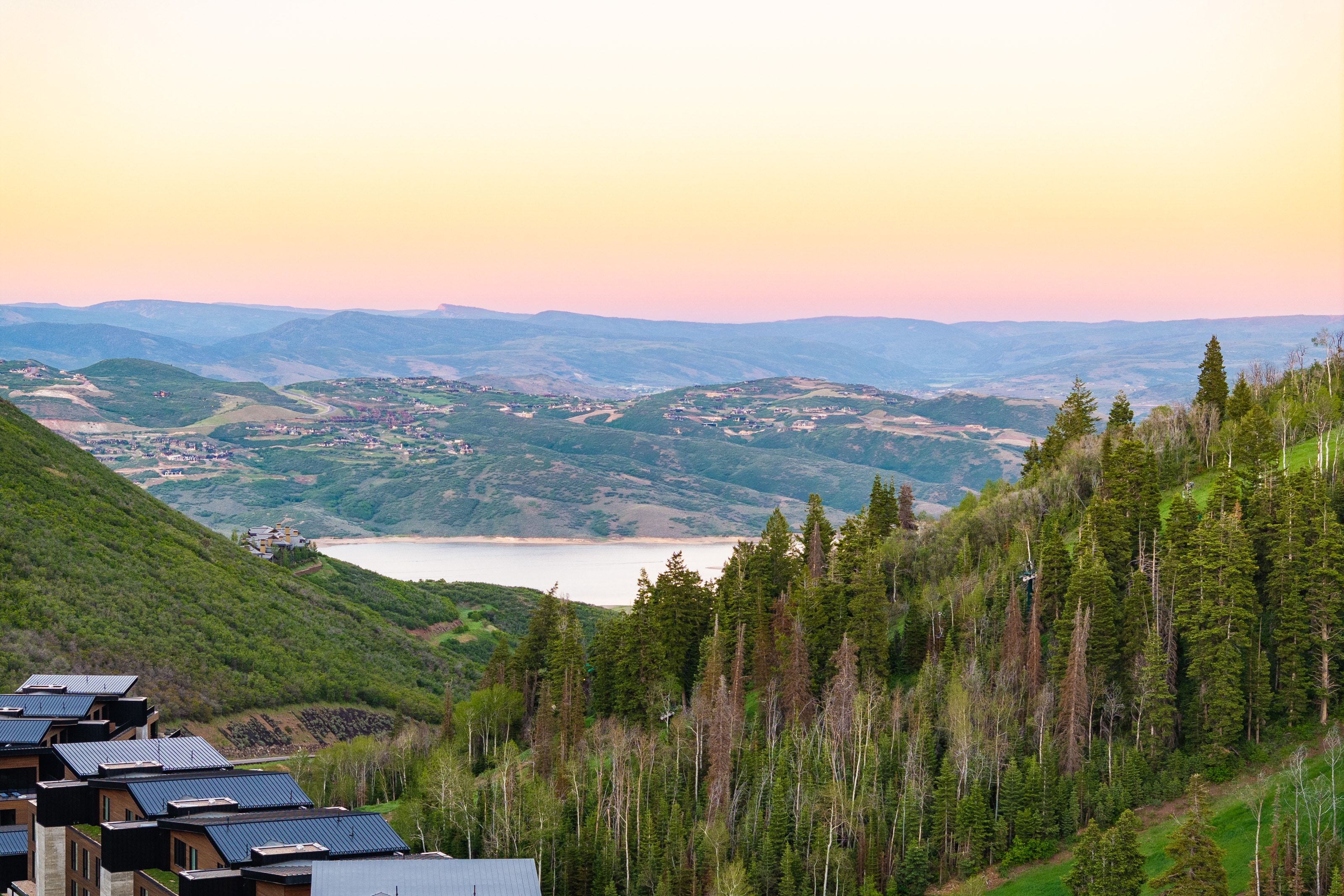 Expansive mountain landscape featuring a large body of water